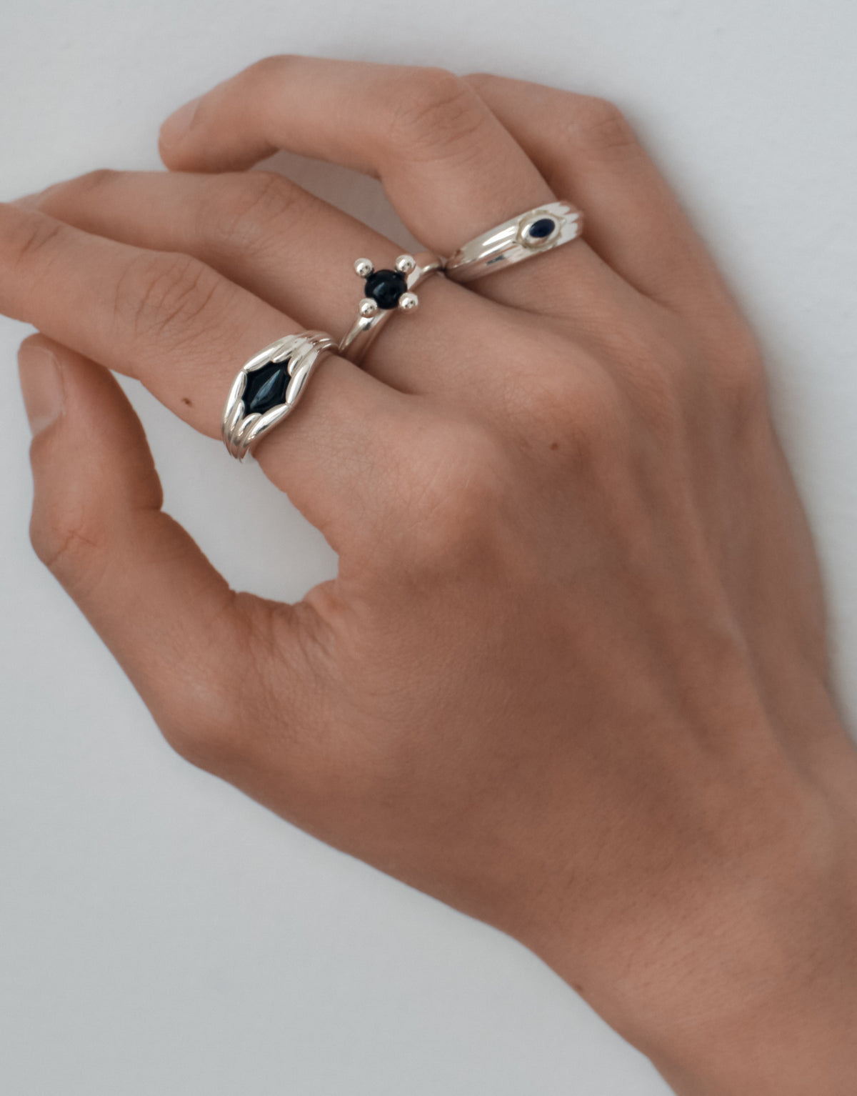 Eyelet Scallop Ring worn on the model, upcycled glass Eco Gem set in sterling silver. Handmade in Los Angeles. Eyelet Scallop Ring by CLED.