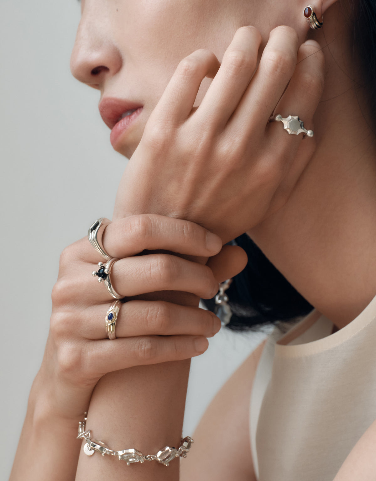 Eyelet Scallop Ring worn on the model, upcycled glass Eco Gem set in sterling silver. Handmade in Los Angeles. Eyelet Scallop Ring by CLED.