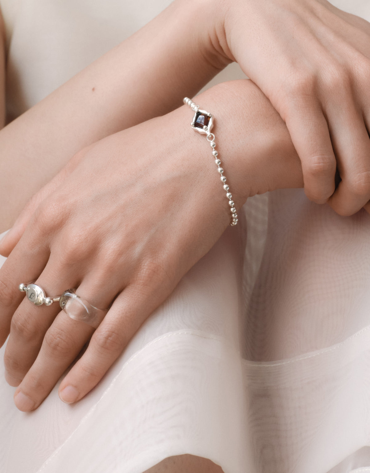 LAS Oval Swivel Ring | Metal worn on the model with other CLED pieces, cast in sterling silver. Handmade in Los Angeles. LAS Oval Swivel Ring | Metal by CLED.