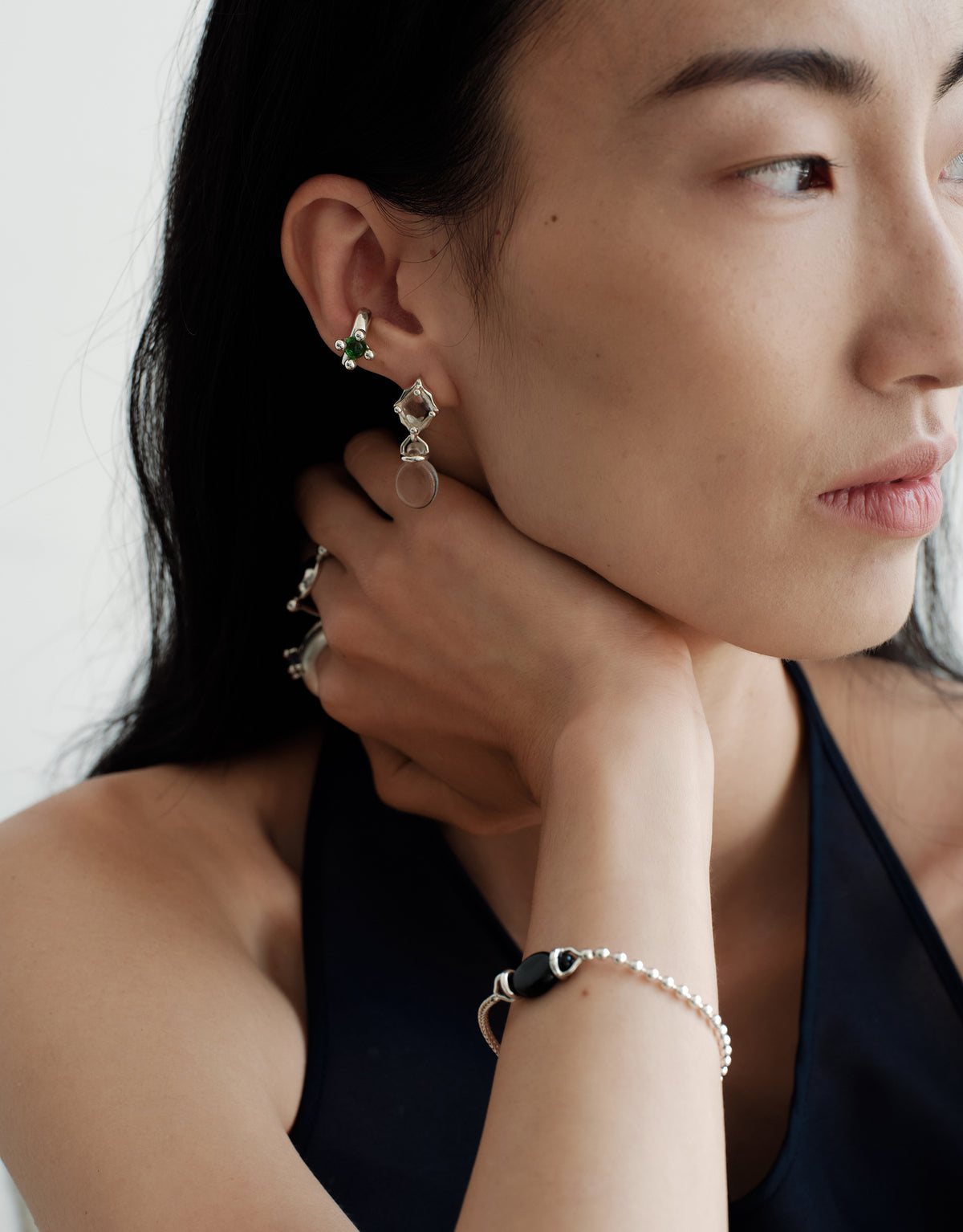 Picot Ear Cuff worn on the model, upcycled glass Eco Gem set in sterling silver. Handmade in Los Angeles. Picot Ear Cuff by CLED.