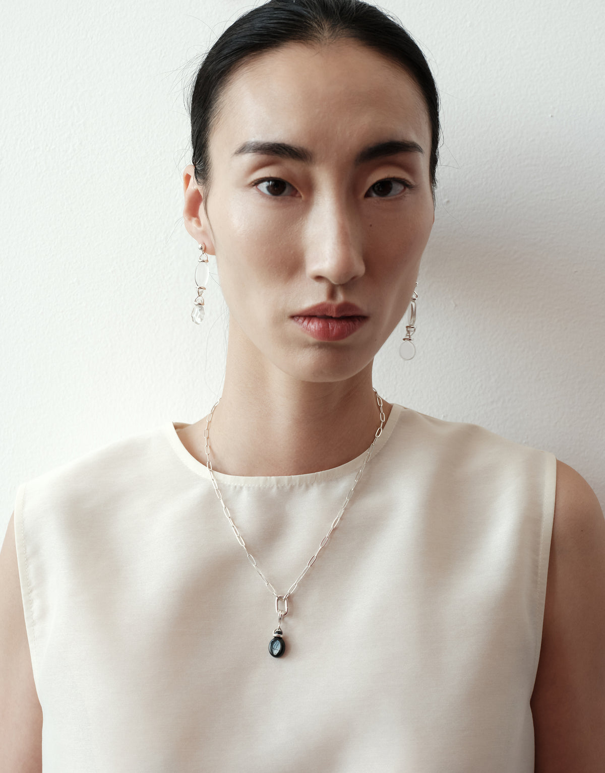 Picot Linear Earrings worn on the model, upcycled glass Eco Gem set in sterling silver. Handmade in Los Angeles. Picot Linear Earrings by CLED.