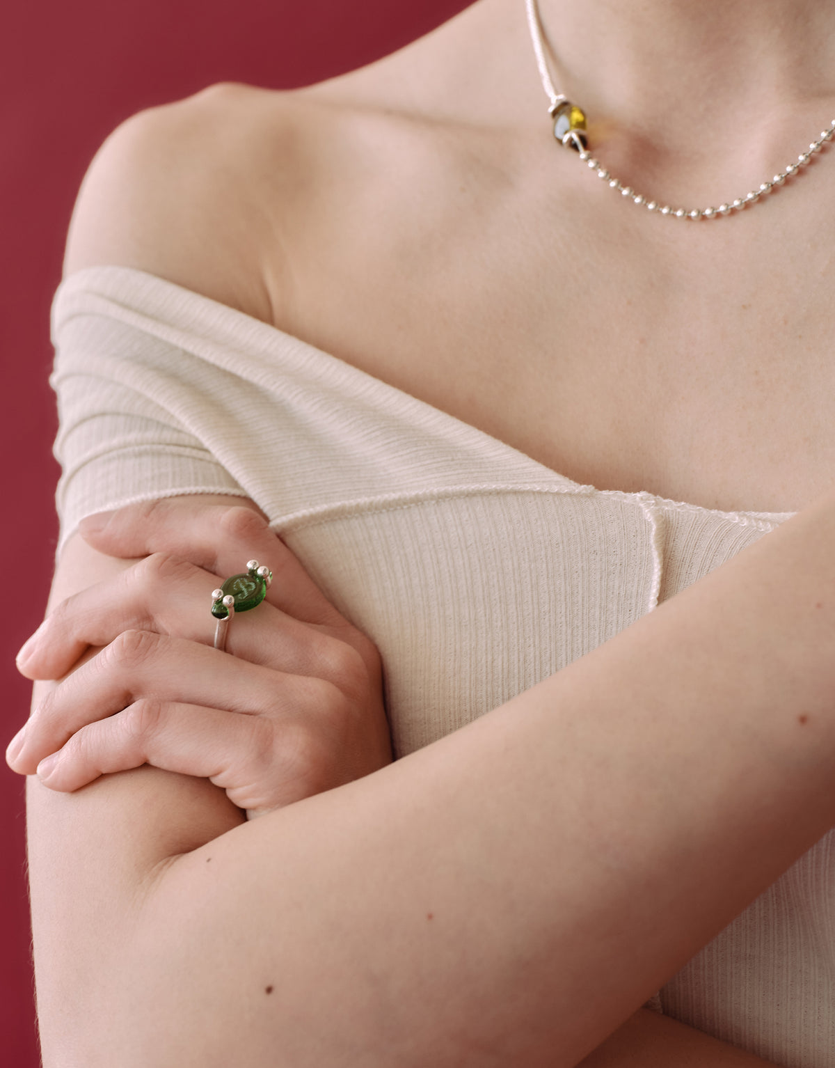 LAS Oval Swivel Ring worn on the model, upcycled glass Eco Gem set in sterling silver. Handmade in Los Angeles. LAS Oval Swivel Ring by CLED.