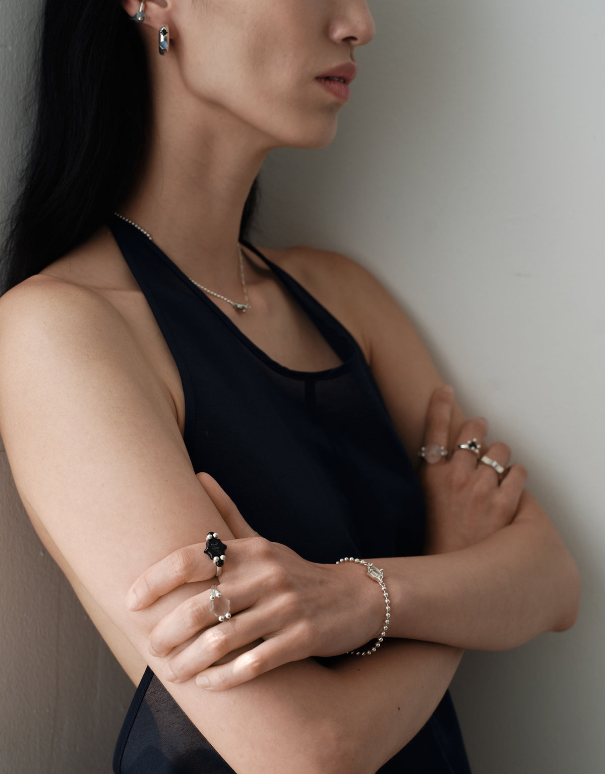 LAS Oval Swivel Ring | Engraving worn on the model, sterling silver rings styled with a black halter top. Handmade in Los Angeles. LAS Oval Swivel Ring | Engraving by CLED.