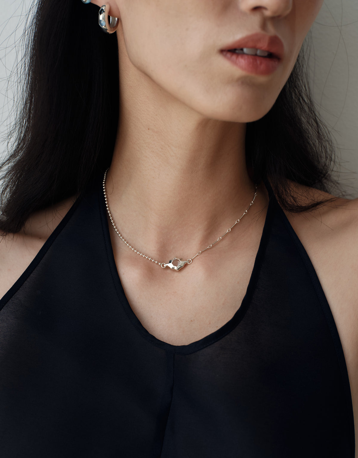 Interlace Necklace worn on the model, upcycled glass Eco Gem set in sterling silver. Handmade in Los Angeles. Interlace Necklace by CLED.