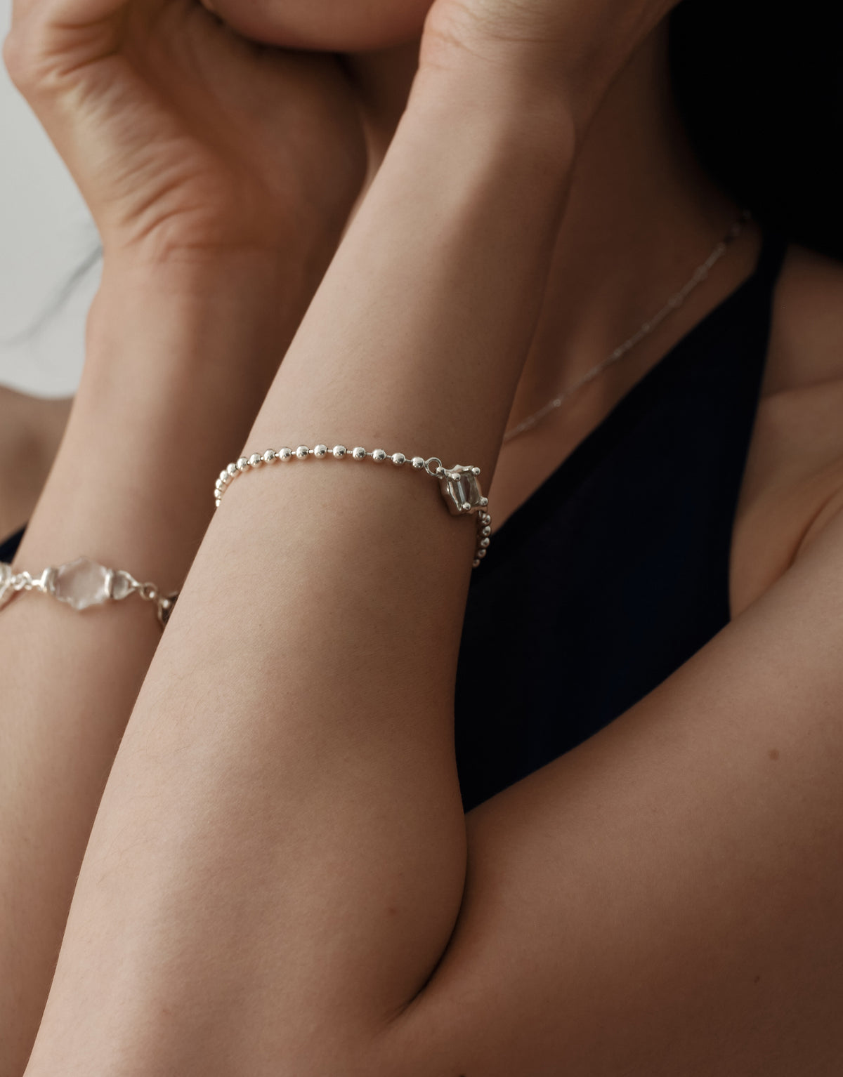 Interlace Bracelet worn on the model, upcycled glass Eco Gem set in sterling silver. Handmade in Los Angeles. Interlace Bracelet by CLED.