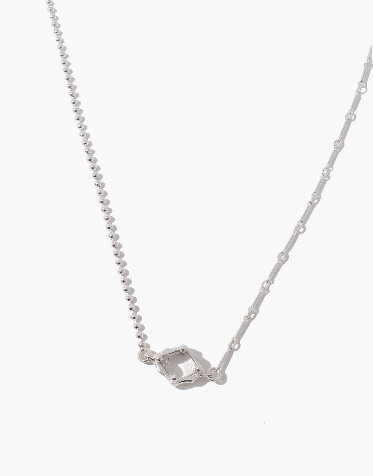 Interlace Necklace in sterling silver with a clear glass Eco Gem in a beaded frame, joining a ball chain on one side and a bar chain on the other. Interlace Necklace by CLED.