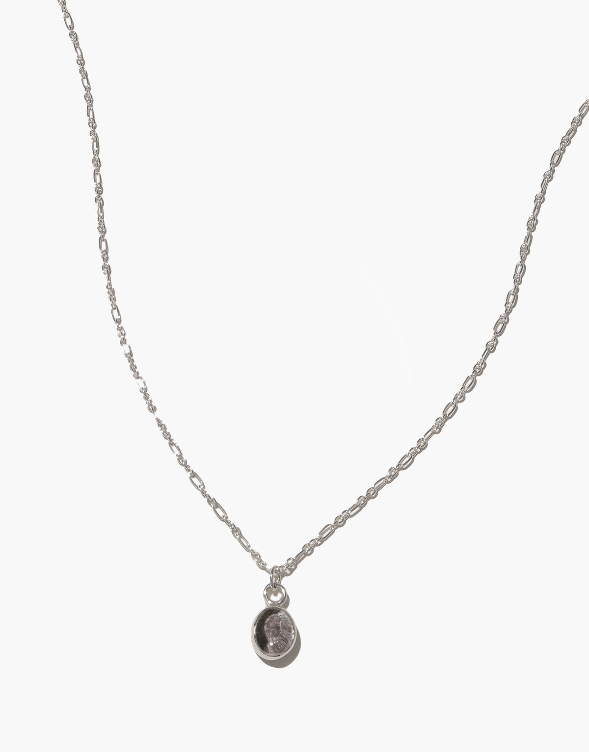 Delicate silver chain necklace with small oval charm pendant featuring upcycled eco glass, adjustable length, handmade in Los Angeles. Oval Charm Necklace by CLED
