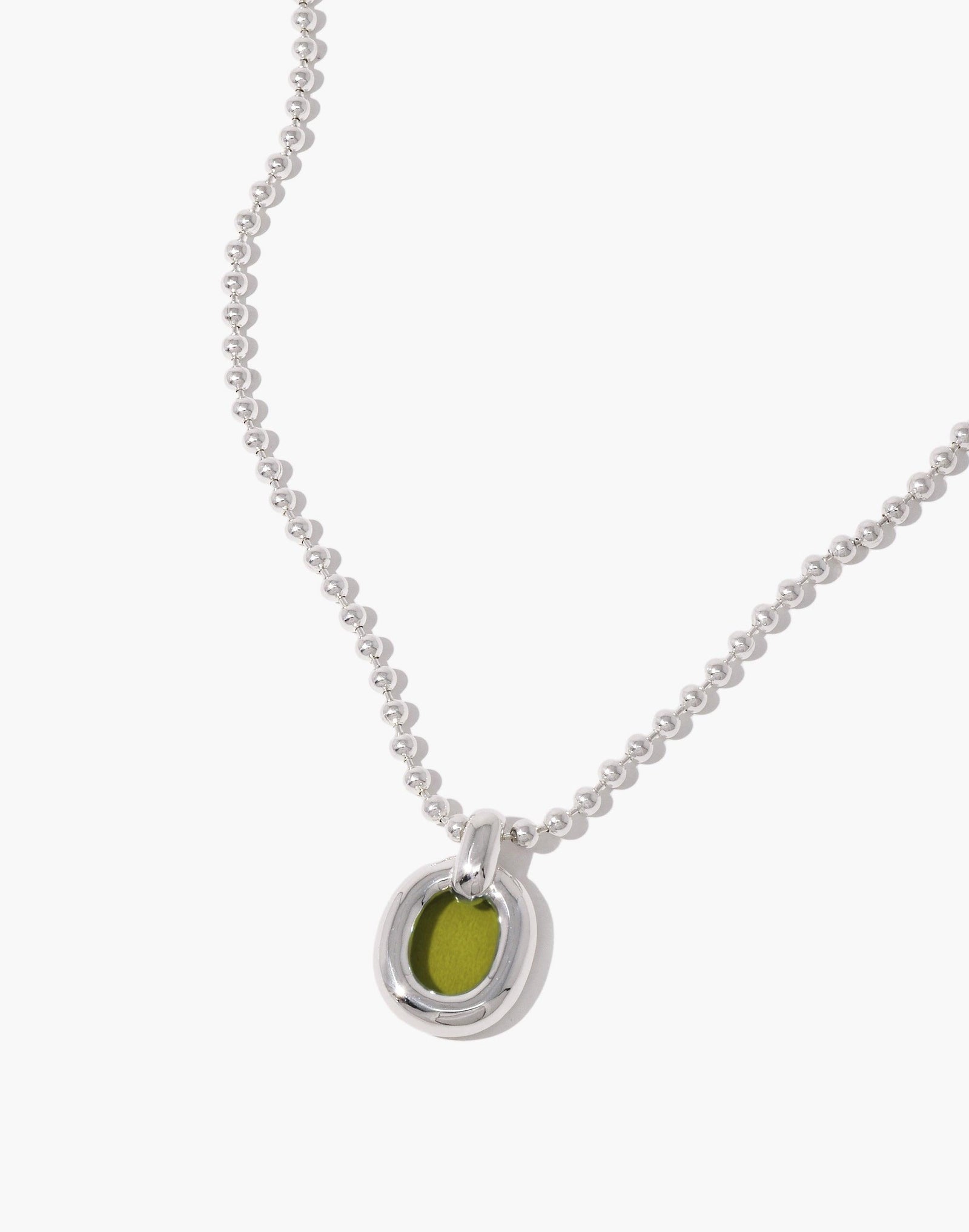 Elegant silver ball chain necklace with circular pendant featuring lime green accent, symbolizing unity and upcycling. Core Loop Necklace | Ball Chain showcases minimalist design and sustainable craftsmanship by CLED.