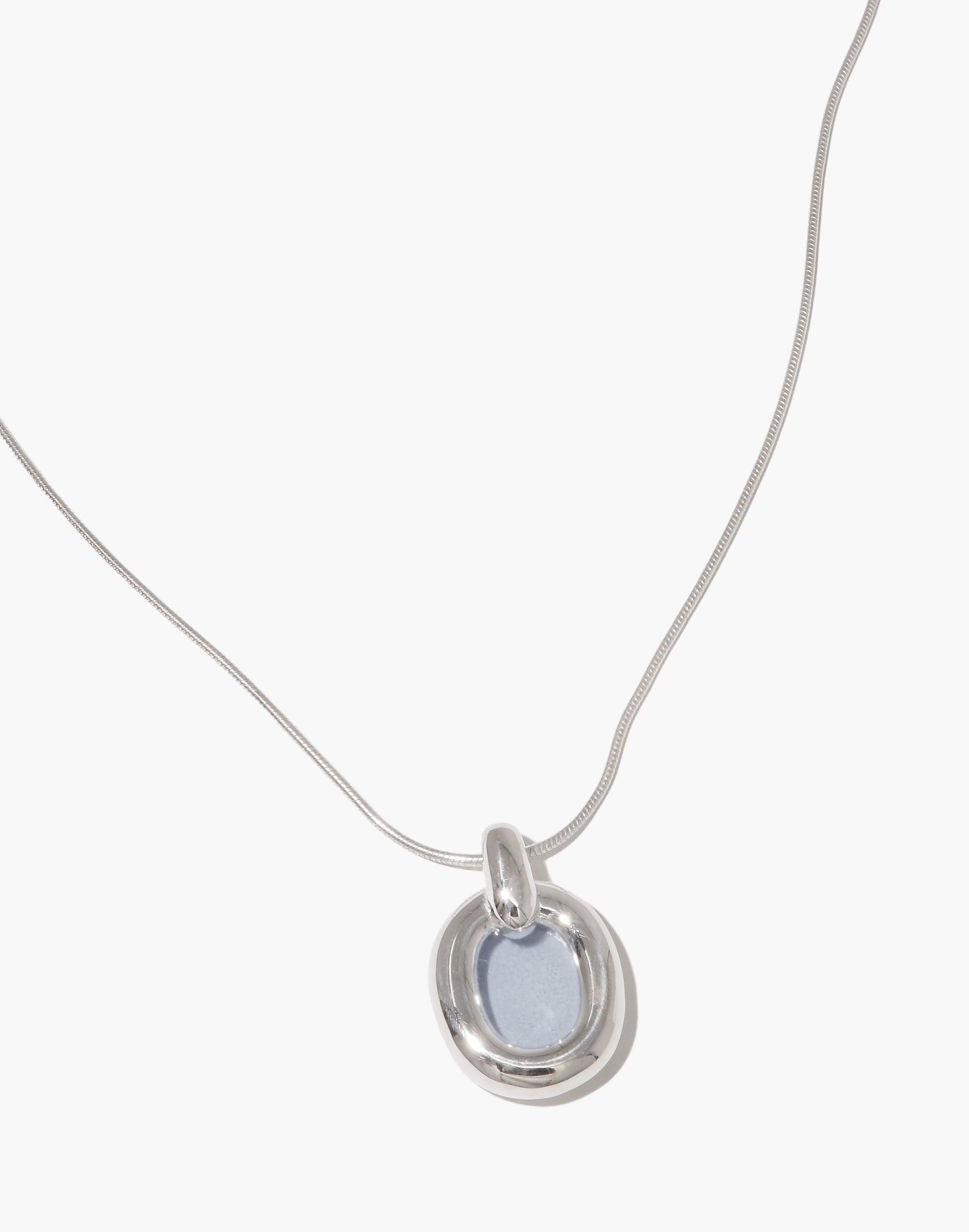 Elegant Core Loop Necklace with snake chain and circular pendant featuring upcycled light blue material, symbolizing unity and sustainable fashion. Minimalist design perfect for everyday wear. Core Loop Necklace | Snake Chain by CLED