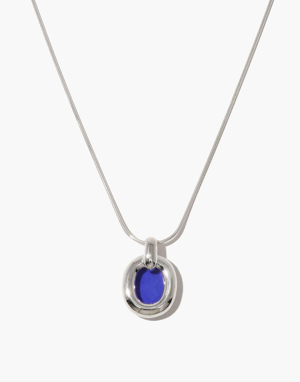 Elegant Core Loop Necklace featuring a sleek snake chain and circular pendant with vibrant blue upcycled glass accent. Modern, sustainable design symbolizing unity and interconnectedness. Perfect for everyday wear or special occasions. Core Loop Necklace | Snake Chain by CLED.