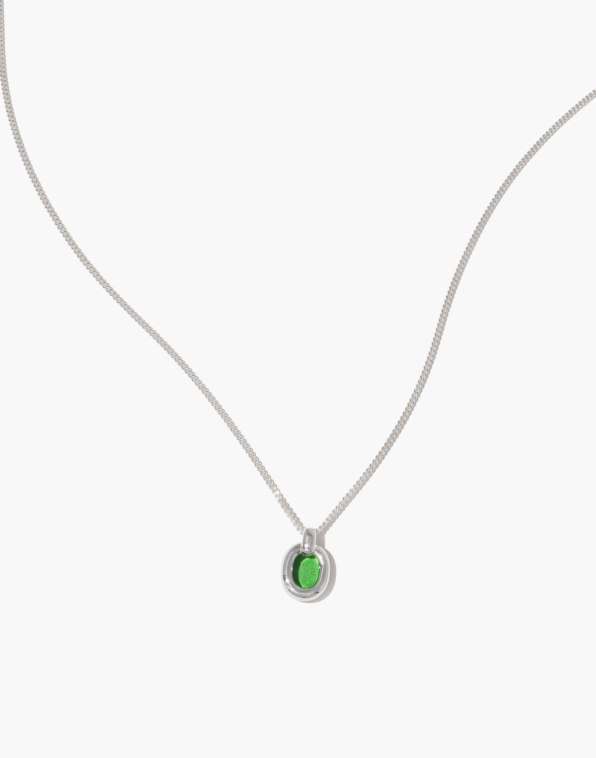 Elegant Small Core Loop Necklace featuring a delicate silver chain and a unique green pendant, showcasing sustainable design and unity. Part of the In The Loop collection, symbolizing connection and upcycling. Perfect for eco-conscious fashion lovers. Small Core Loop Necklace by CLED.
