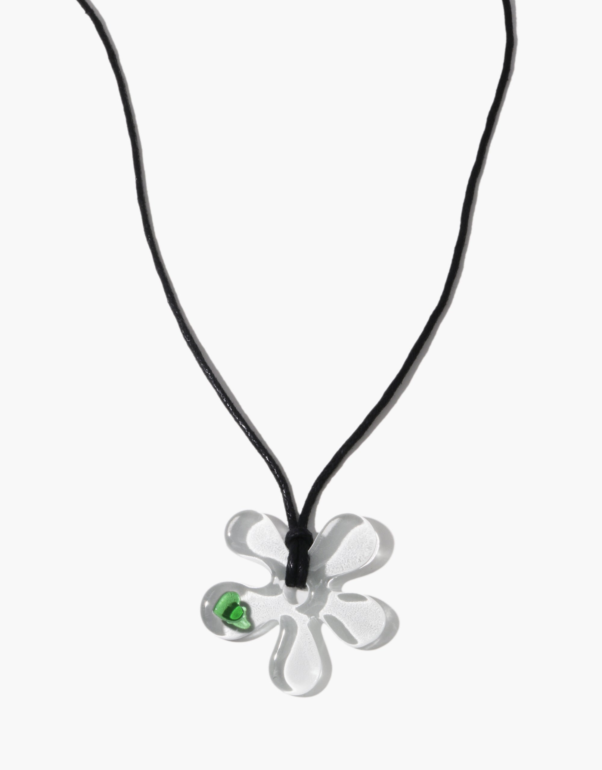 Petal Sculpture Necklace with clear glass flower pendant and green heart detail on black cotton cord by CLED