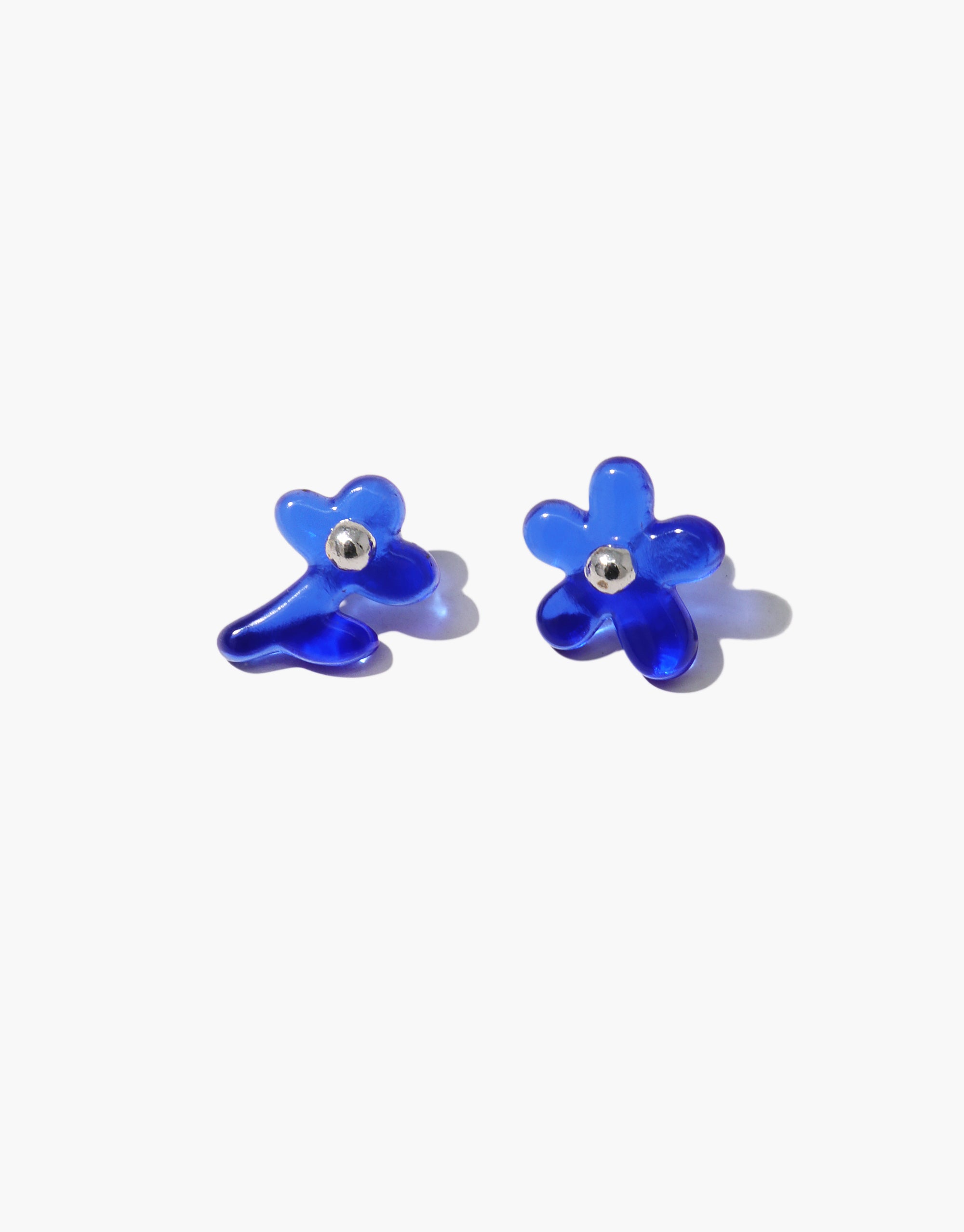Petal Icon Stud Earrings featuring cobalt blue glass floral designs with crystal accents, sculptural asymmetric style by CLED