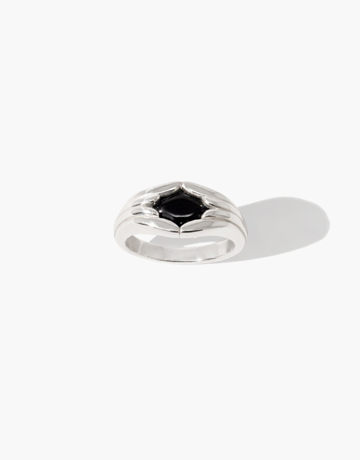 Fluted Ring in sterling silver with fluted lines gathering toward a black basalt glass Eco Gem at the center. Sculptural design from the Las Collection. Fluted Ring by CLED.