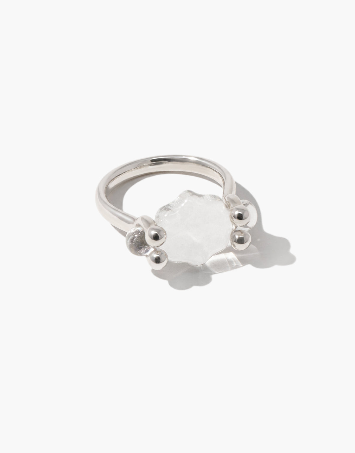 Las Swivel Ring in sterling silver with a scalloped clear glass Eco Gem held between beaded posts, free to turn on its axis. Lace inspired design from the Las Collection. Las Swivel Ring | Scallop by CLED.