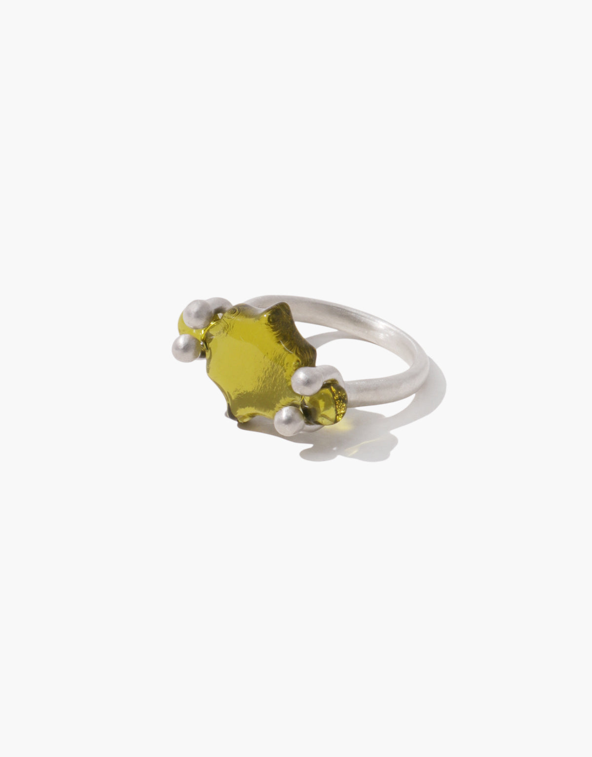 Las Swivel Ring | Scallop in soft light olive glass framed by a scalloped silver edge that turns on its axis. Handmade in Los Angeles. Las Swivel Ring | Scallop by CLED.