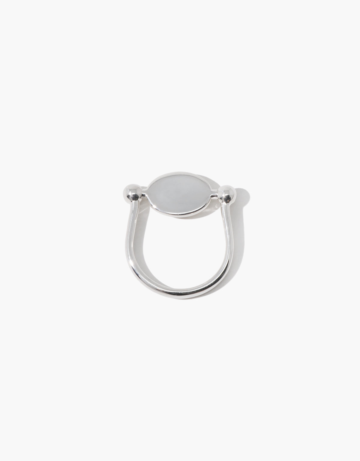 LAS Oval Swivel Ring | Metal cast in sterling silver, the smooth form turning between two beads. Handmade in Los Angeles. LAS Oval Swivel Ring | Metal by CLED.