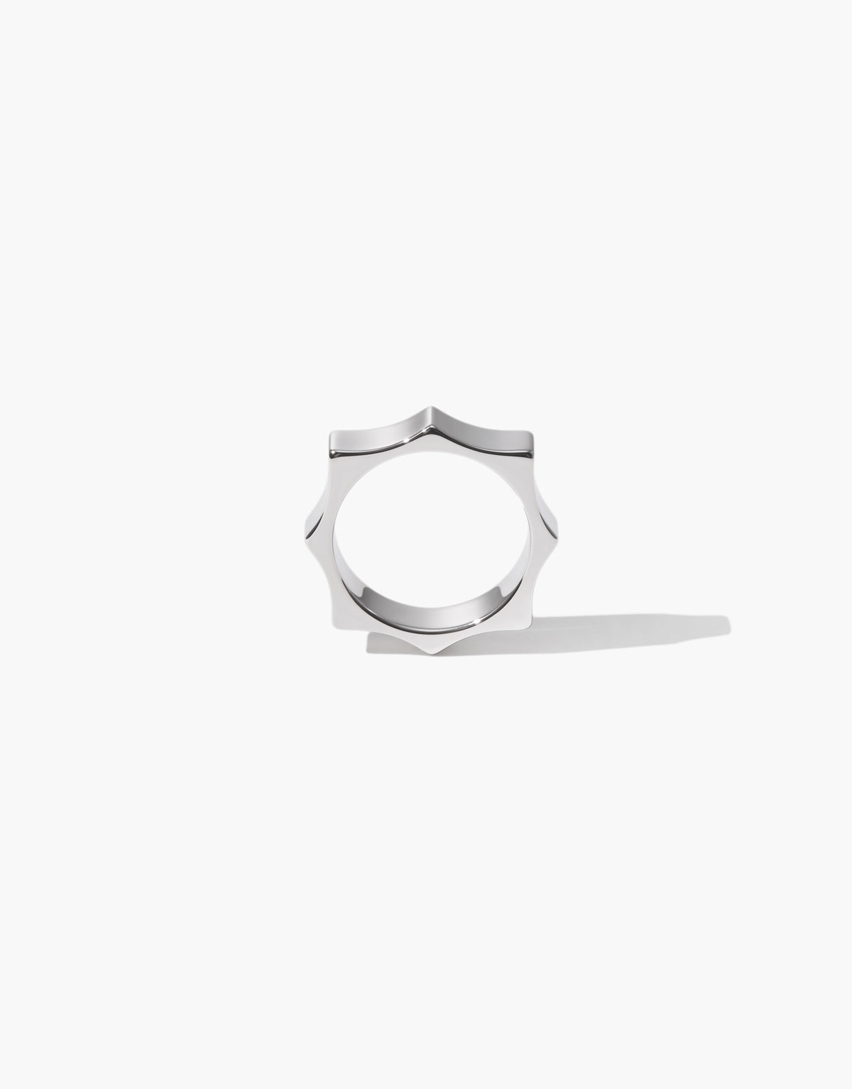 Repeat Ring in polished sterling silver, an eight point band repeating the same scalloped curve all the way around. Repeat Ring by CLED.