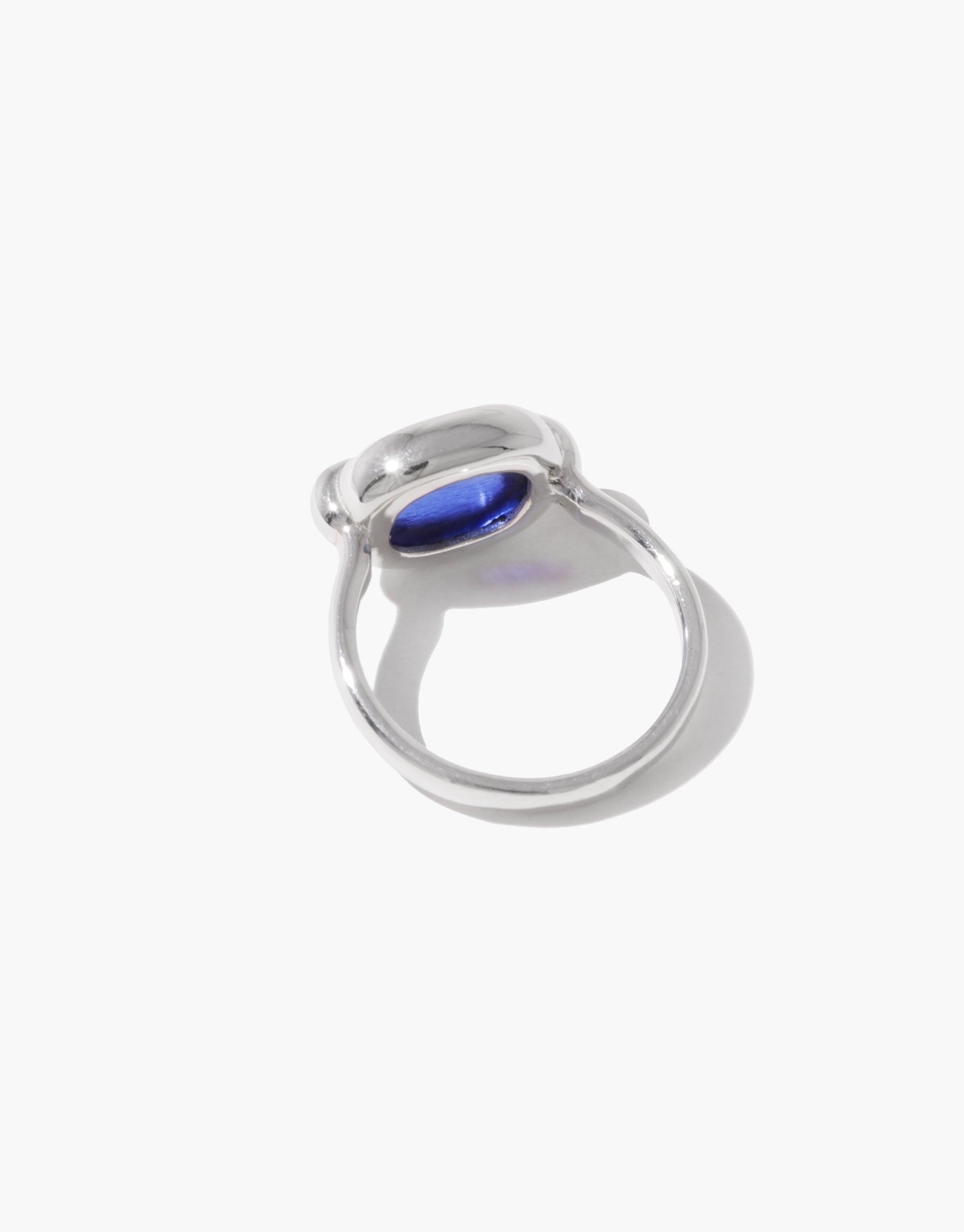 Elegant silver ring with oval blue stone set in a smooth, curved bezel. Sleek design showcases the vibrant blue centerpiece. Core Loop Ring | Small by CLED