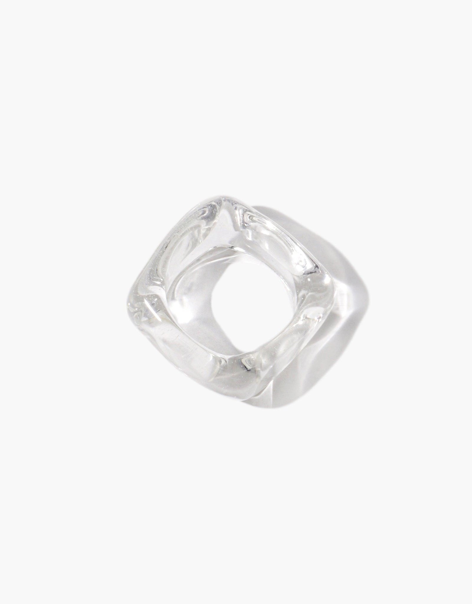 Clear resin Engravable Dice Ring with four flat sides for custom engraving. Unique square-shaped design with smooth curved edges. Transparent material showcases intricate internal details. Versatile and stylish accessory for personalized jewelry. CLED Engravable Dice Ring.