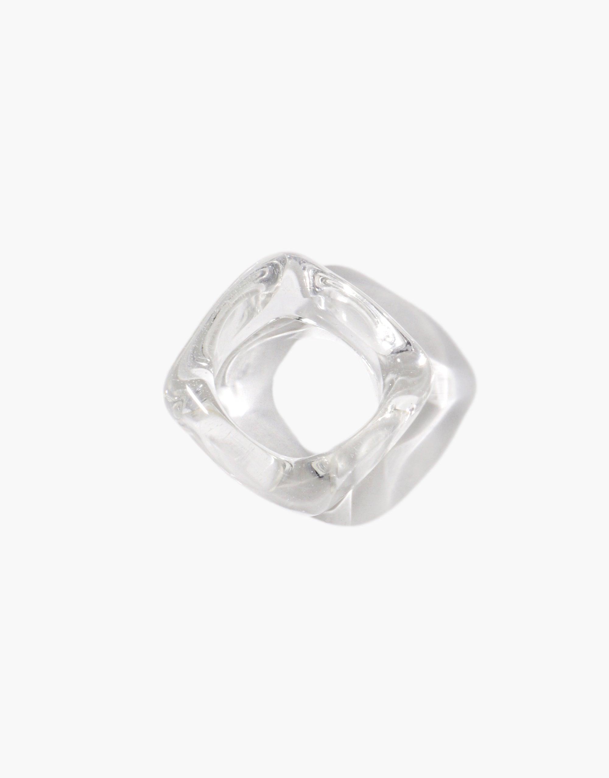 Clear resin Engravable Dice Ring with four flat sides for custom engraving. Unique square-shaped design with smooth curved edges. Transparent material showcases intricate internal details. Versatile and stylish accessory for personalized jewelry. CLED Engravable Dice Ring.