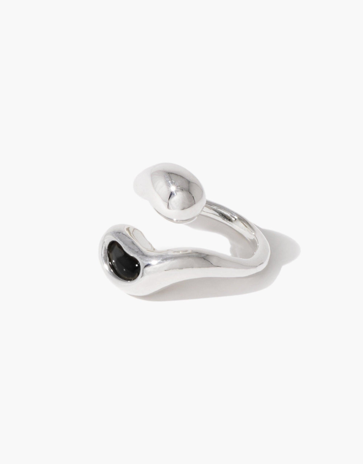 Sprout Ring featuring a silver band with a black stone, inspired by nature's organic pea shapes and crafted from repurposed materials, reflecting growth and transformation.
