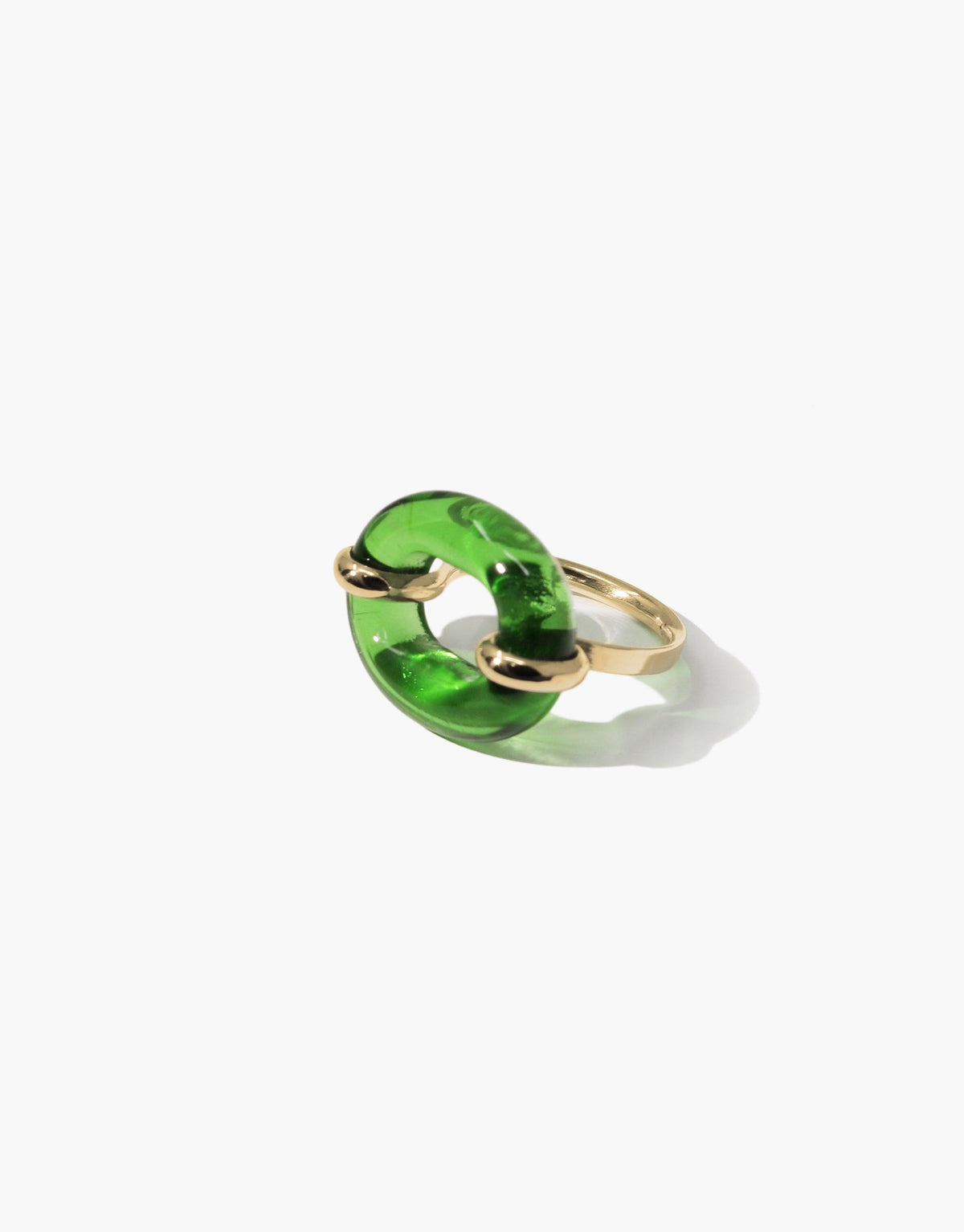Unique green glass loop ring with gold-toned metal setting, symbolizing connection and sustainability. Elegant and modern design for the In The Loop Ring by CLED