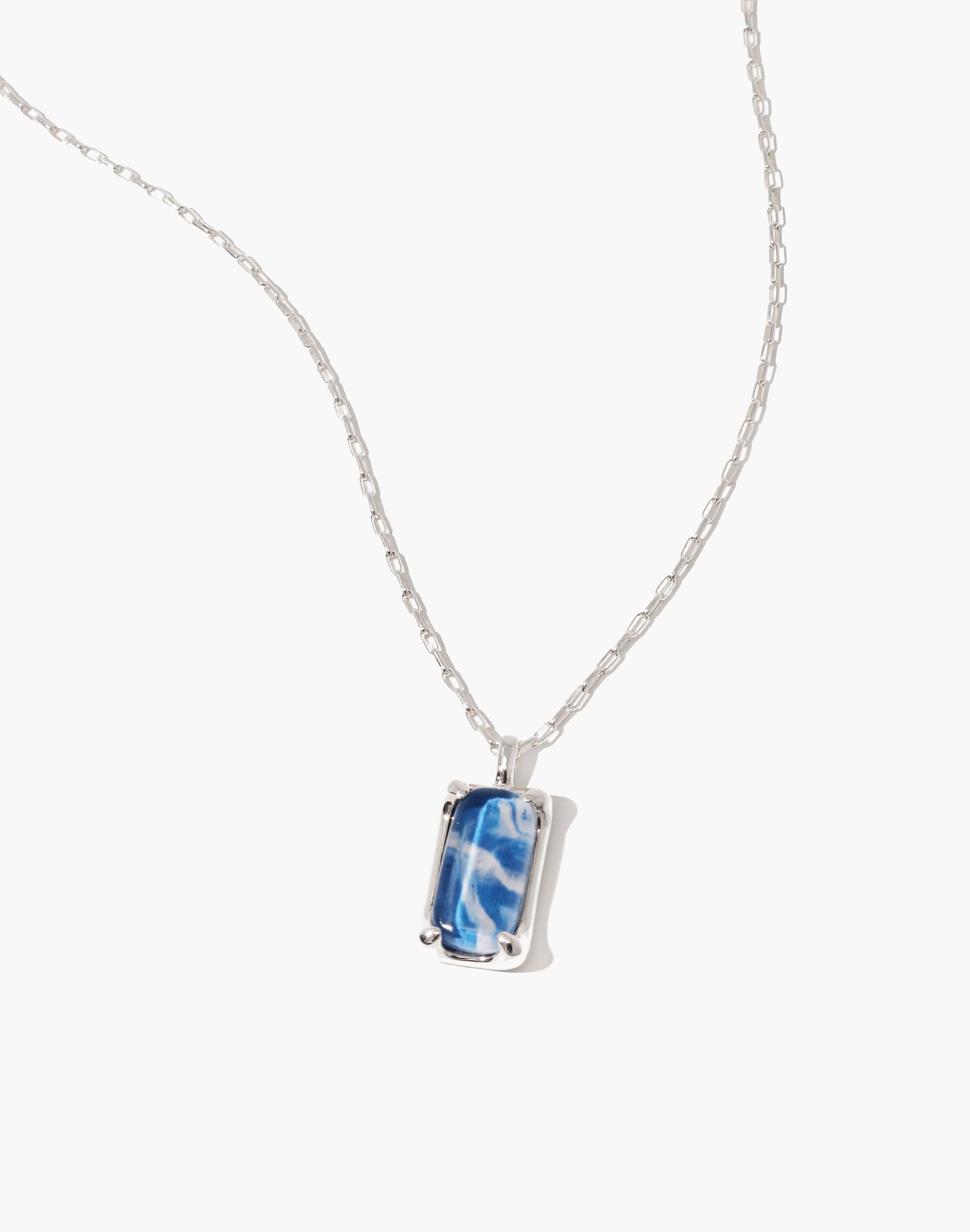 Elegant Prism Necklace featuring a unique blue and white marble-effect pendant made from upcycled glass bottles, suspended on a delicate silver chain. Sustainable jewelry piece showcasing eco-friendly craftsmanship. Prism Necklace | Marble by CLED