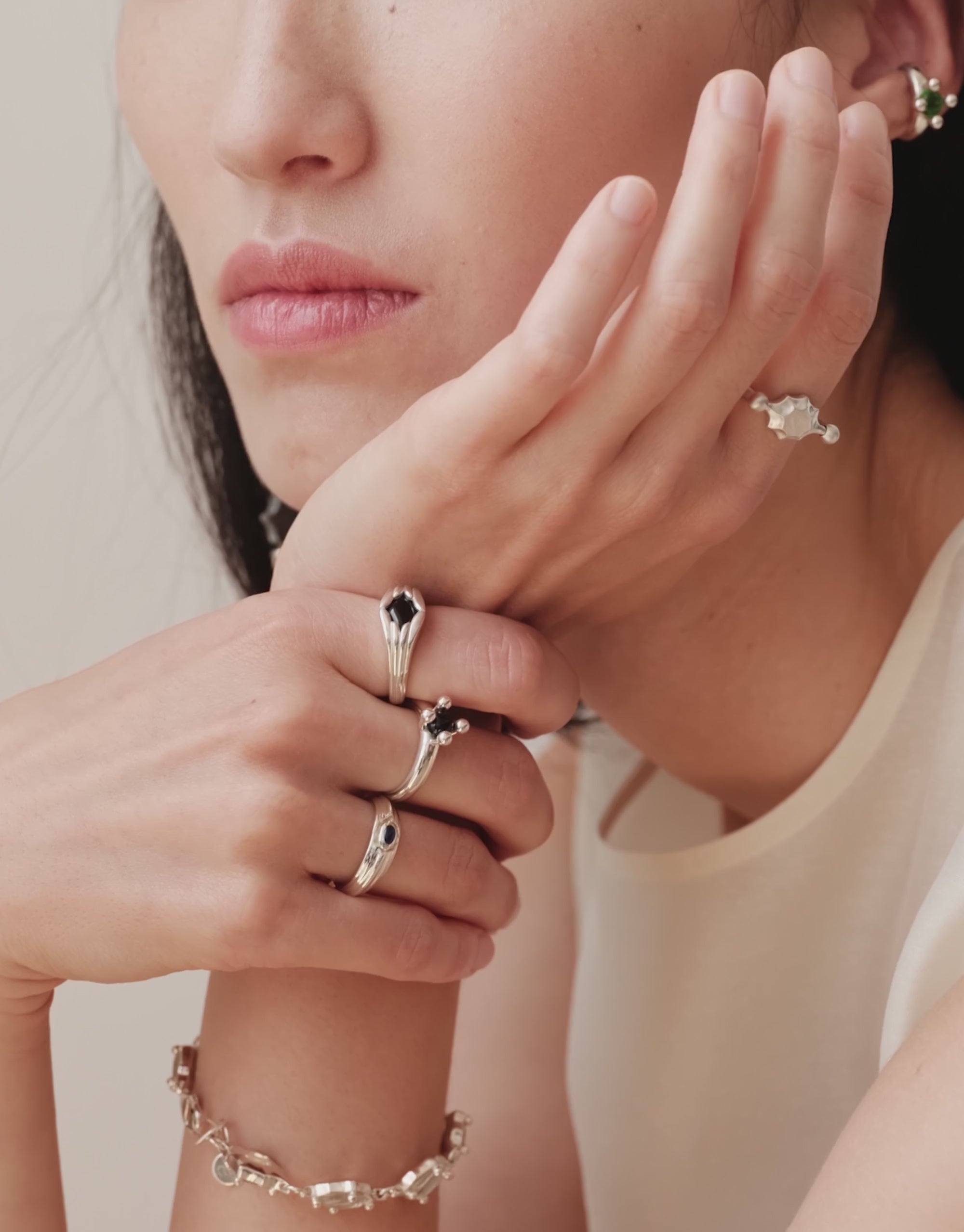 LAS Scallop Swivel Ring | Metal | Engraving shown in motion, the cast sterling silver face turning between two beads. Handmade in Los Angeles. LAS Scallop Swivel Ring | Metal | Engraving by CLED.