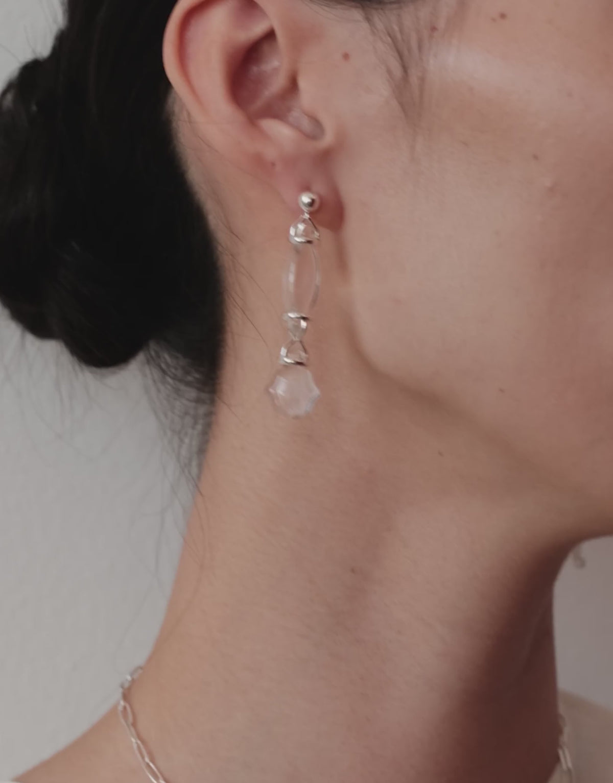 Picot Linear Earrings in motion, worn on the model. Upcycled glass Eco Gems in sterling silver, handmade in Los Angeles. Picot Linear Earrings by CLED.