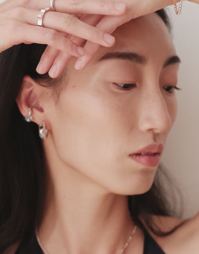Repeat Ring shown in motion, upcycled glass Eco Gems repeating along a sterling silver band. Handmade in Los Angeles. Repeat Ring by CLED.