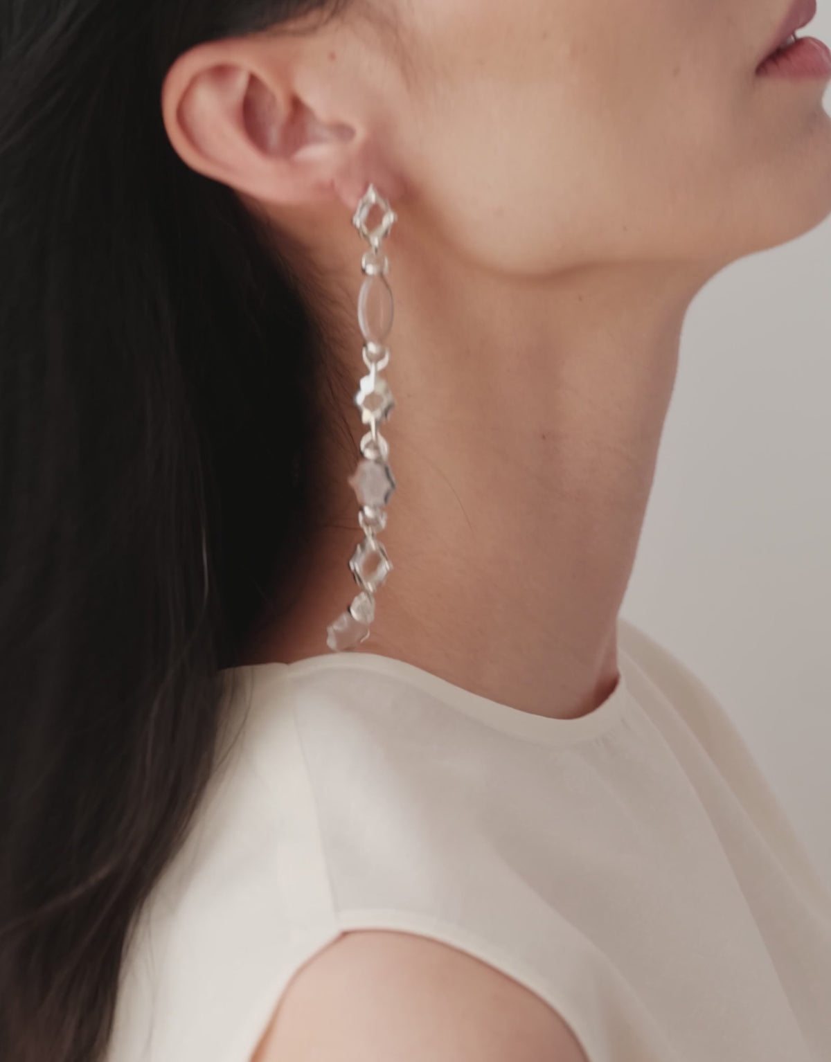 Cadence Linear Earring in clear glass in motion, a long drop of upcycled glass Eco Gems swaying in sterling silver. Cadence Linear Earring by CLED.