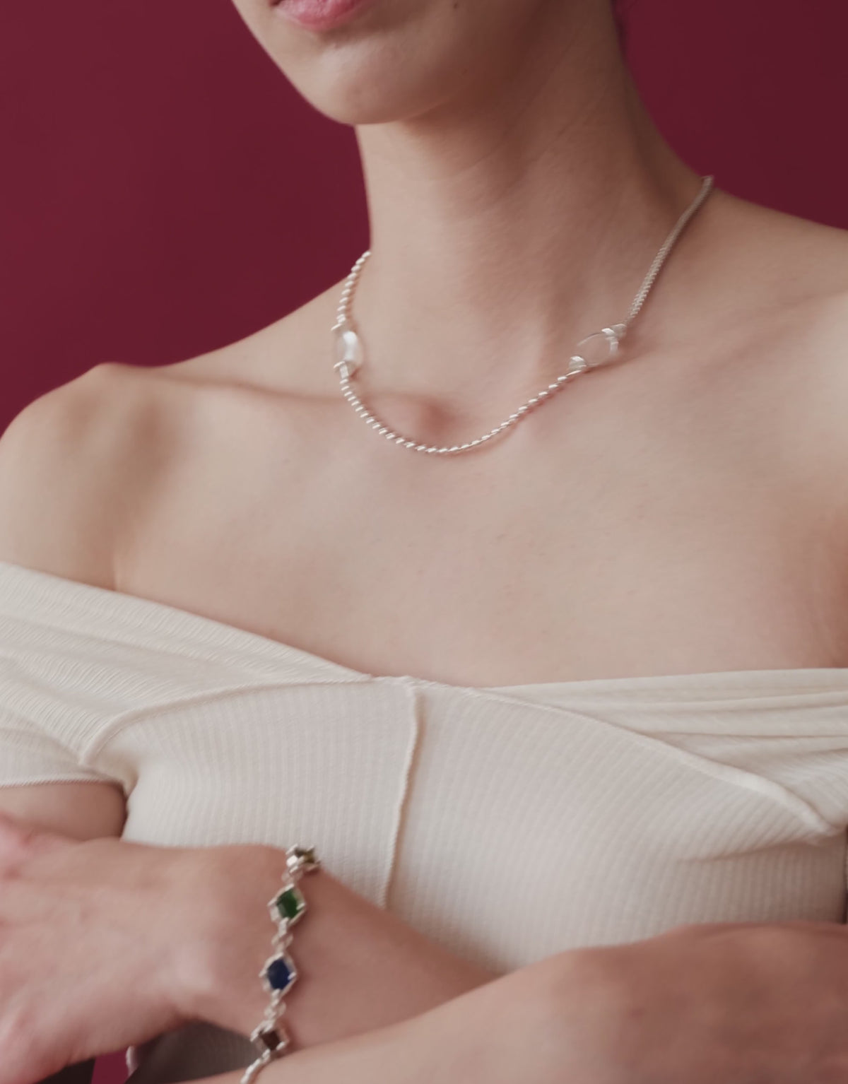 Picot Necklace in motion, worn on the model. Upcycled glass Eco Gems in sterling silver, handmade in Los Angeles. Picot Necklace by CLED.
