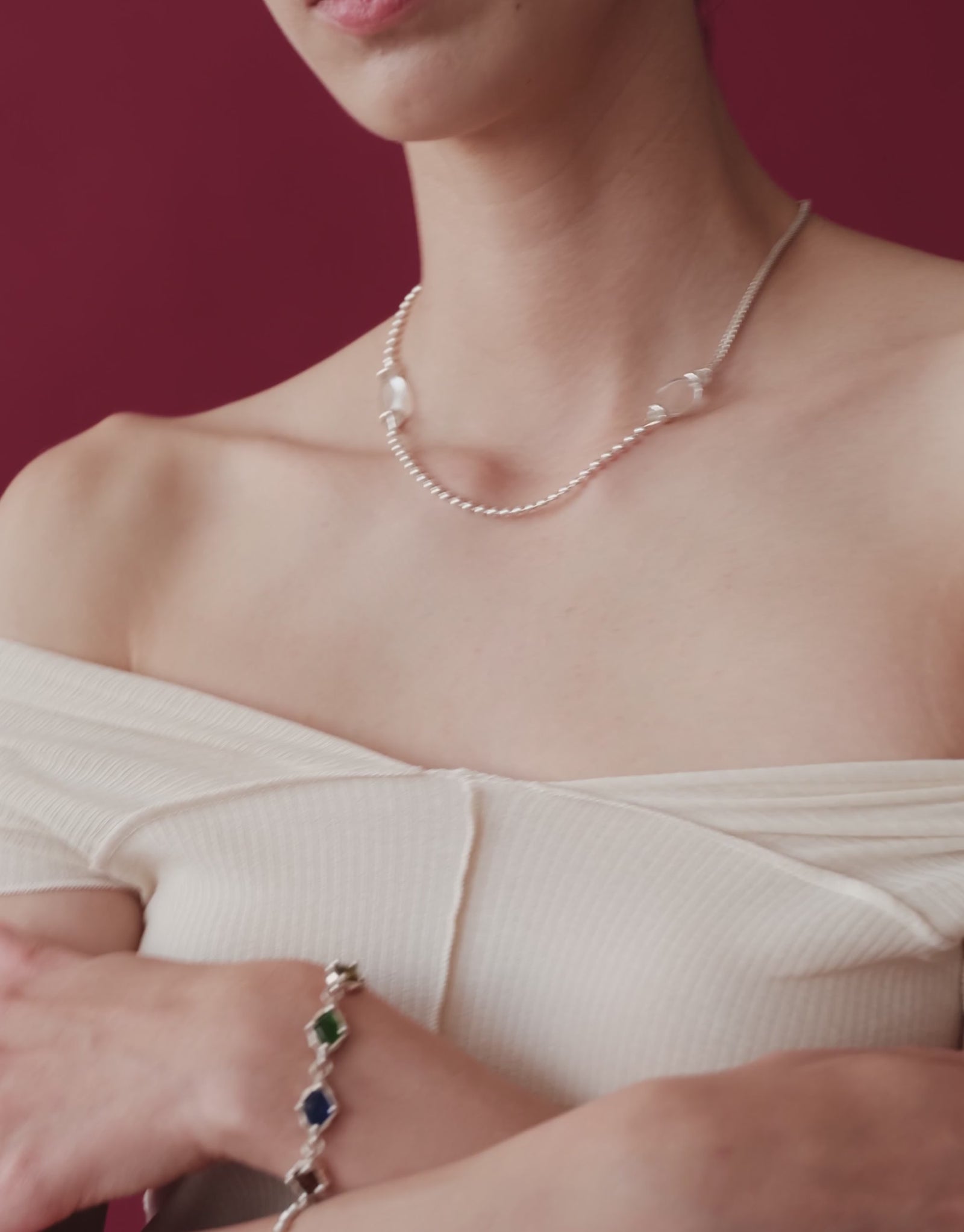 Picot Necklace in motion, worn on the model. Upcycled glass Eco Gems in sterling silver, handmade in Los Angeles. Picot Necklace by CLED.