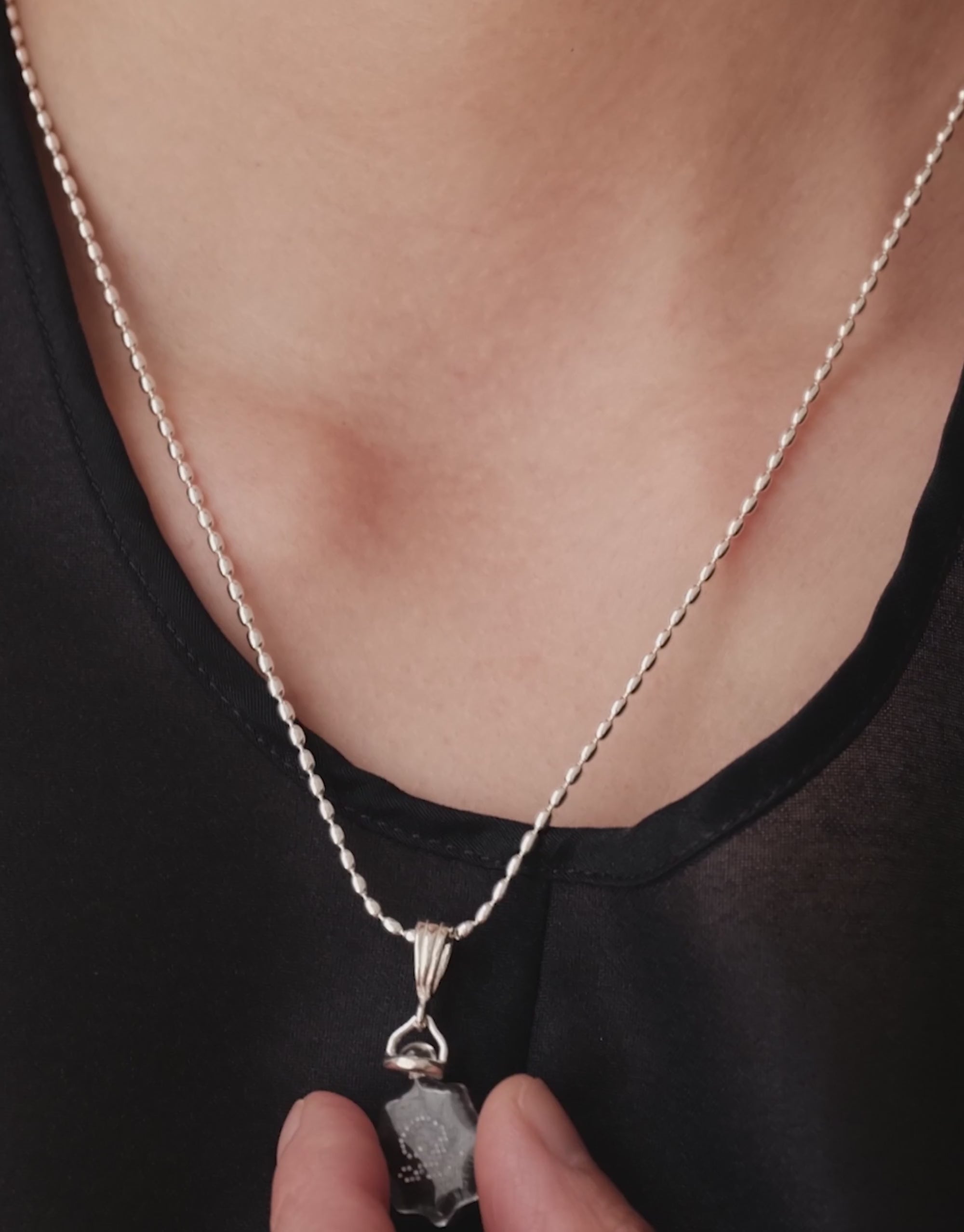LAS Scallop Pendant in motion, worn on the model. Upcycled glass Eco Gems in sterling silver, handmade in Los Angeles. LAS Scallop Pendant by CLED.