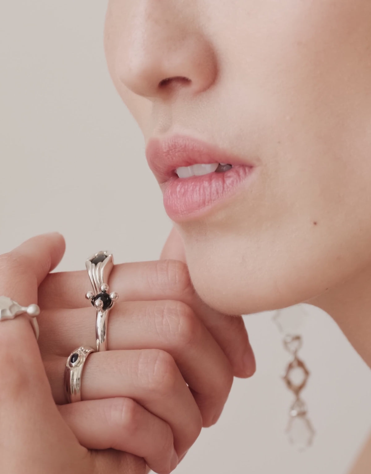 Eyelet Scallop Ring shown in motion, an upcycled glass Eco Gem set in sterling silver. Handmade in Los Angeles. Eyelet Scallop Ring by CLED.