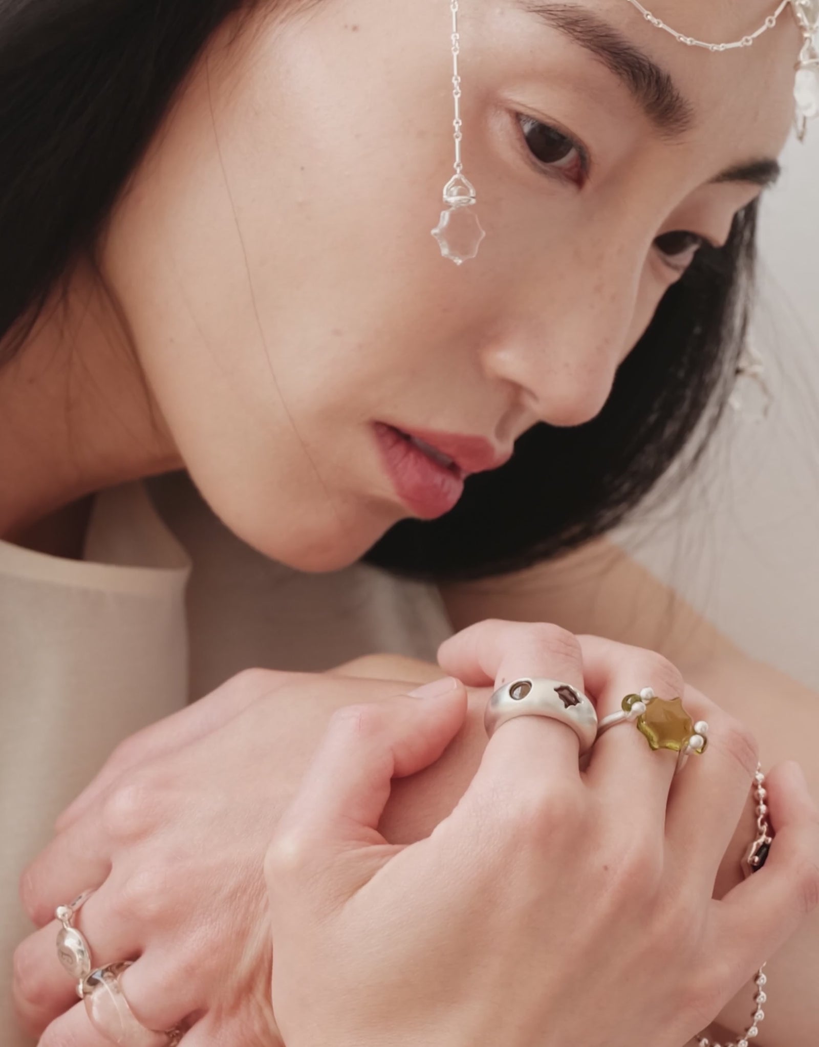 LAS Scallop Swivel Ring | Engraving shown in motion, the scalloped glass Eco Gem turning between two beads in sterling silver. Handmade in Los Angeles. LAS Scallop Swivel Ring | Engraving by CLED.