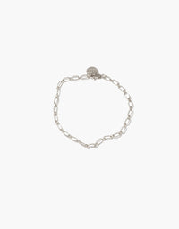 Sleek silver chain bracelet with delicate oval links and circular charm, perfect for customization with Icon charms or as a standalone statement piece. Icon Chain Bracelet | B by CLED