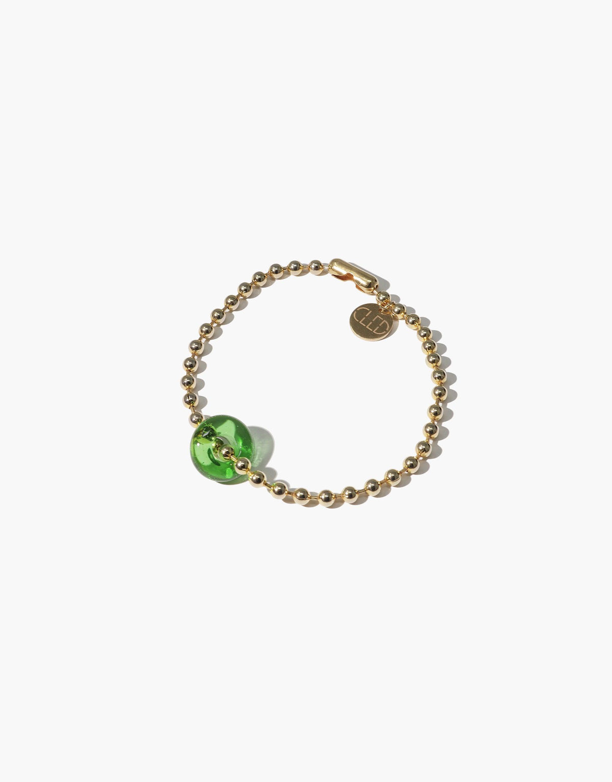 Donut Ball Bracelet featuring gold-toned beaded chain with a vibrant green eco-gem centerpiece, showcasing sustainable luxury and prismatic beauty. Handcrafted design with circular brand charm, perfect for eco-conscious fashion lovers. CLED Donut Ball Bracelet.
