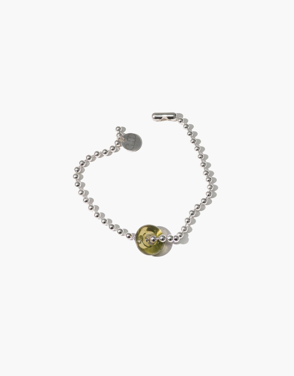Elegant silver ball chain bracelet with circular eco-friendly glass pendant in yellow and clear, showcasing sustainable luxury. Donut Ball Bracelet by CLED featuring handcrafted design and eco-conscious materials.
