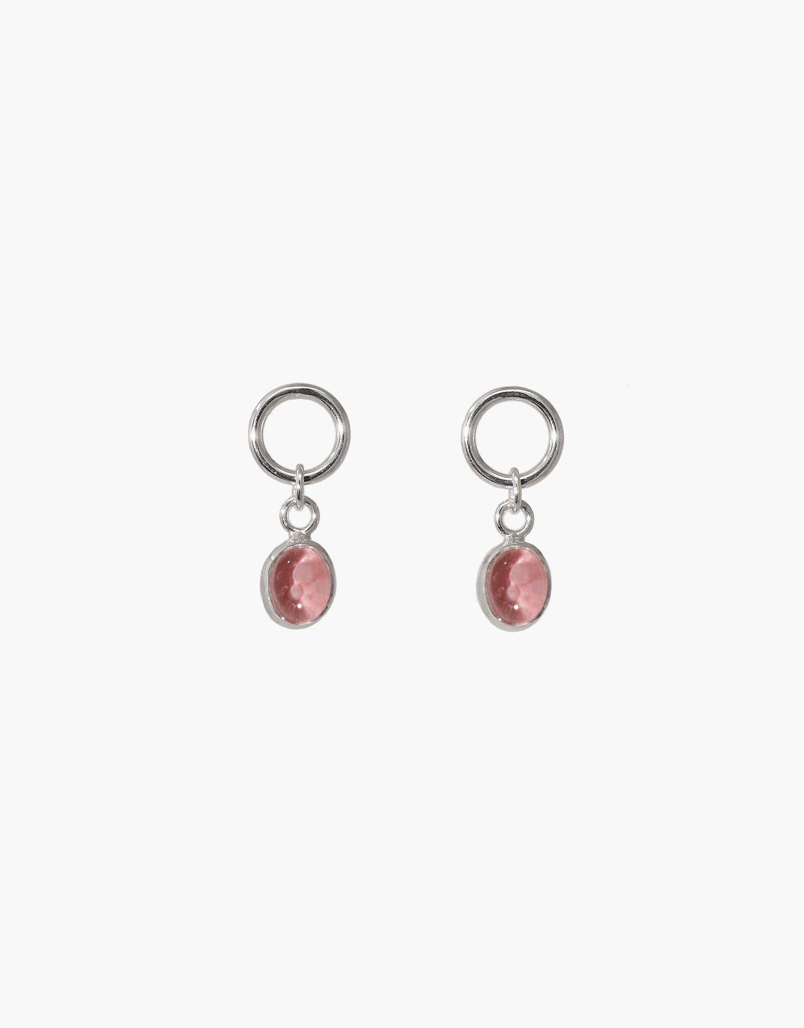 Oval Dangling Earrings featuring delicate silver hoops with pink upcycled glass charms. Handcrafted jewelry showcasing eco-friendly materials and minimalist design. Elegant and sustainable accessory for conscious fashion lovers. CLED Oval Dangling Earrings.