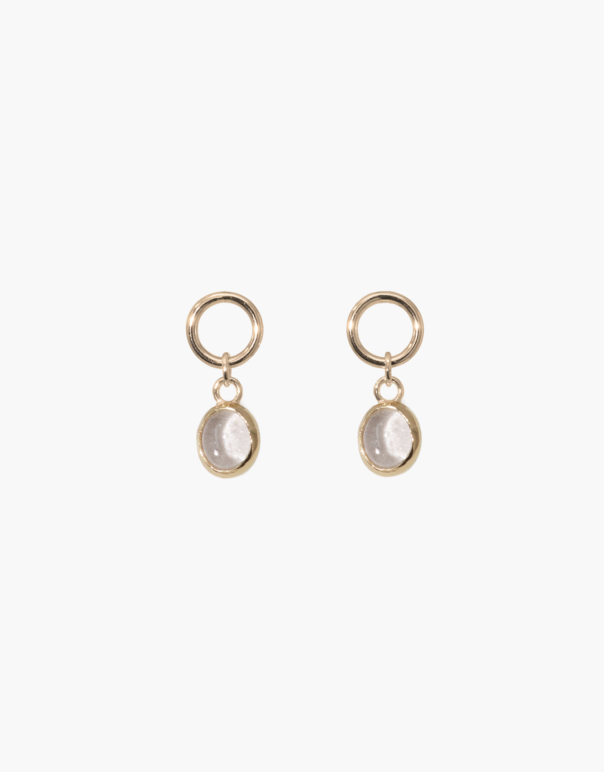 Elegant oval dangling earrings featuring gold-toned hoops and clear upcycled glass charms. Handcrafted design with eco-friendly materials. Perfect for sustainable fashion lovers. Oval Dangling Earrings by CLED.