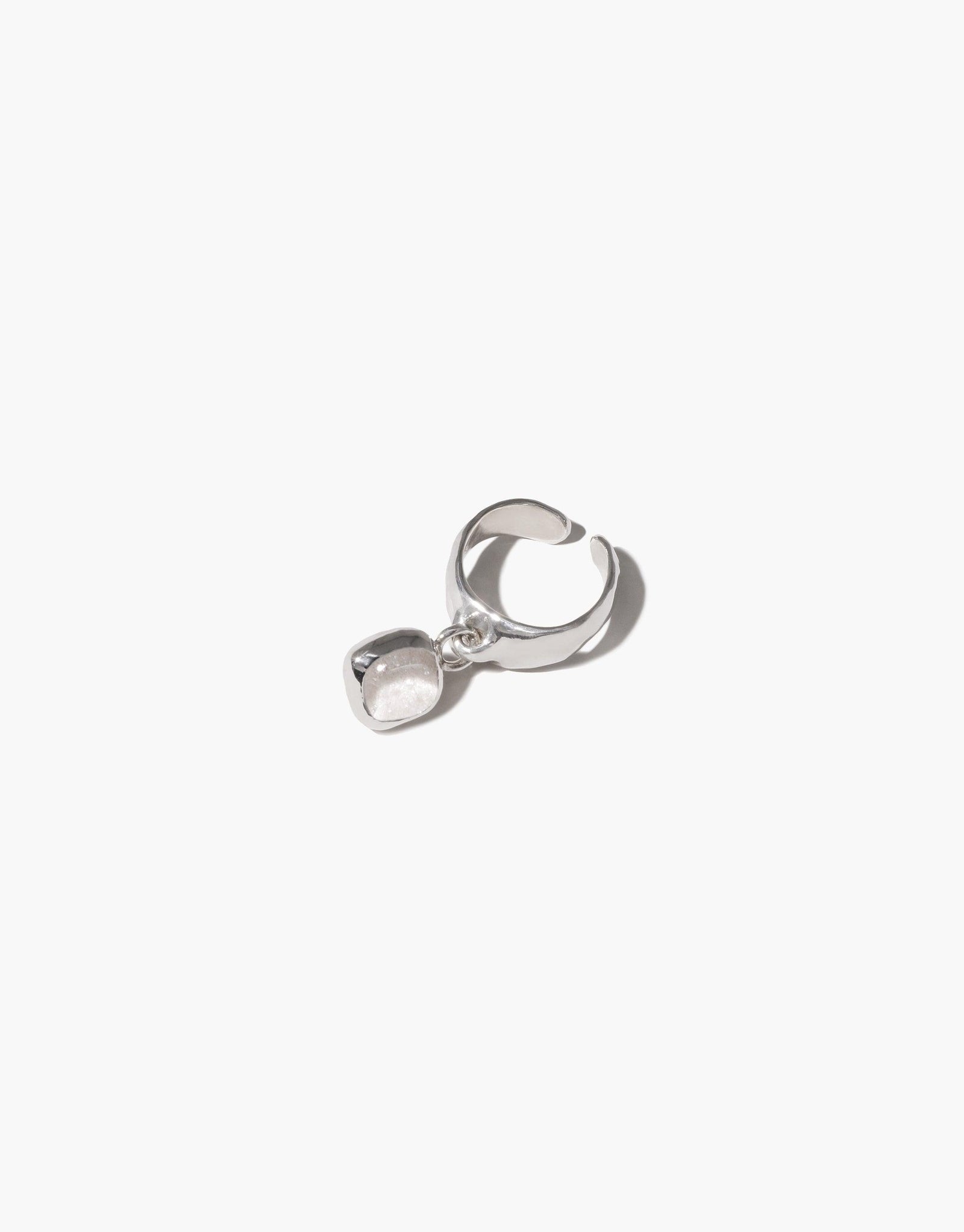 Square Dangling Ear Cuff featuring a silver ring with a charm, crafted from sterling silver with an upcycled Eco Gem. Handmade in Los Angeles, embodying eco-conscious elegance.