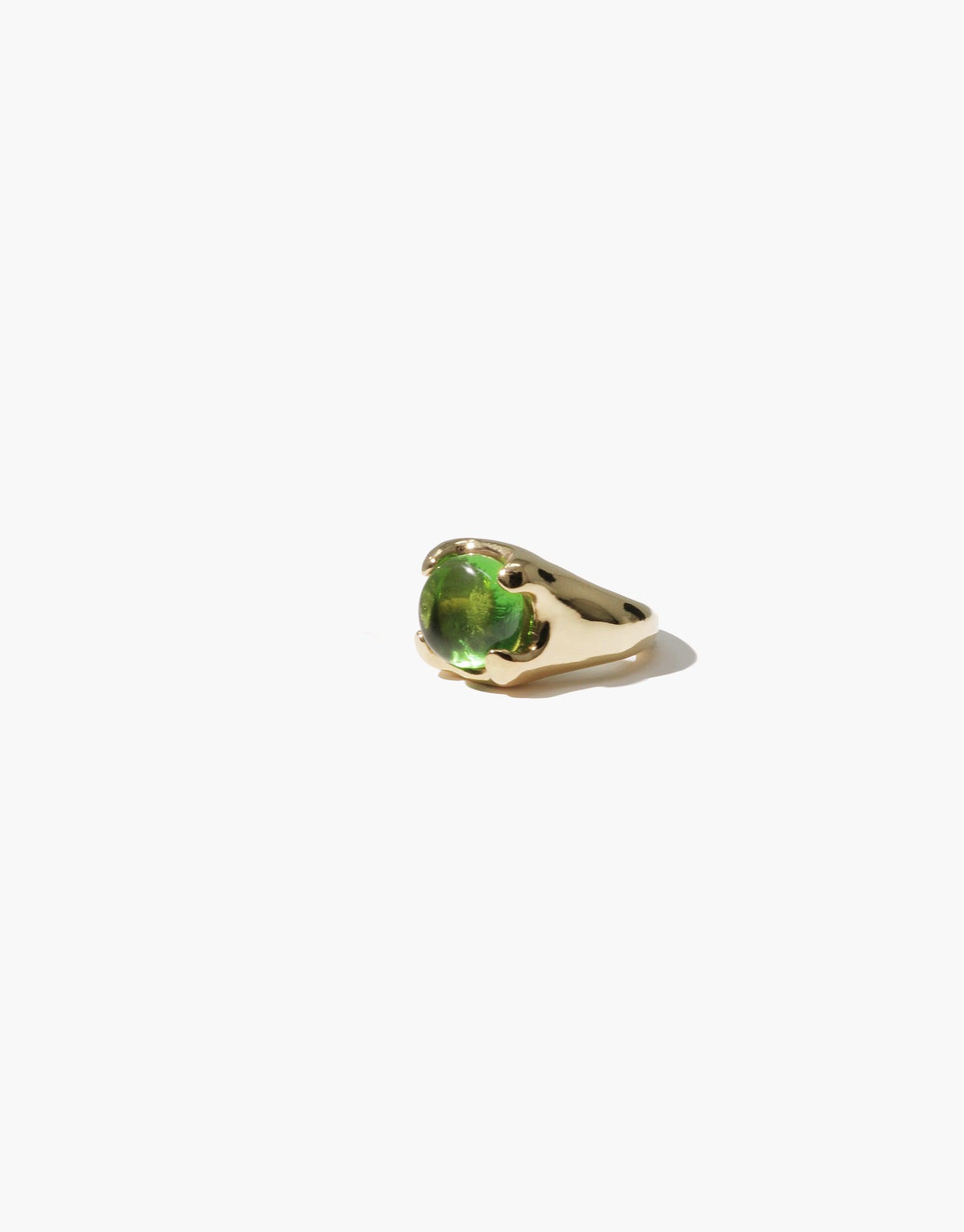 Beam Ear Cuff featuring a gold-toned metal base with a vibrant green eco gem centerpiece, showcasing sustainable luxury jewelry design. Handcrafted ear accessory inspired by prism spectral colors, perfect for eco-conscious fashion enthusiasts. CLED