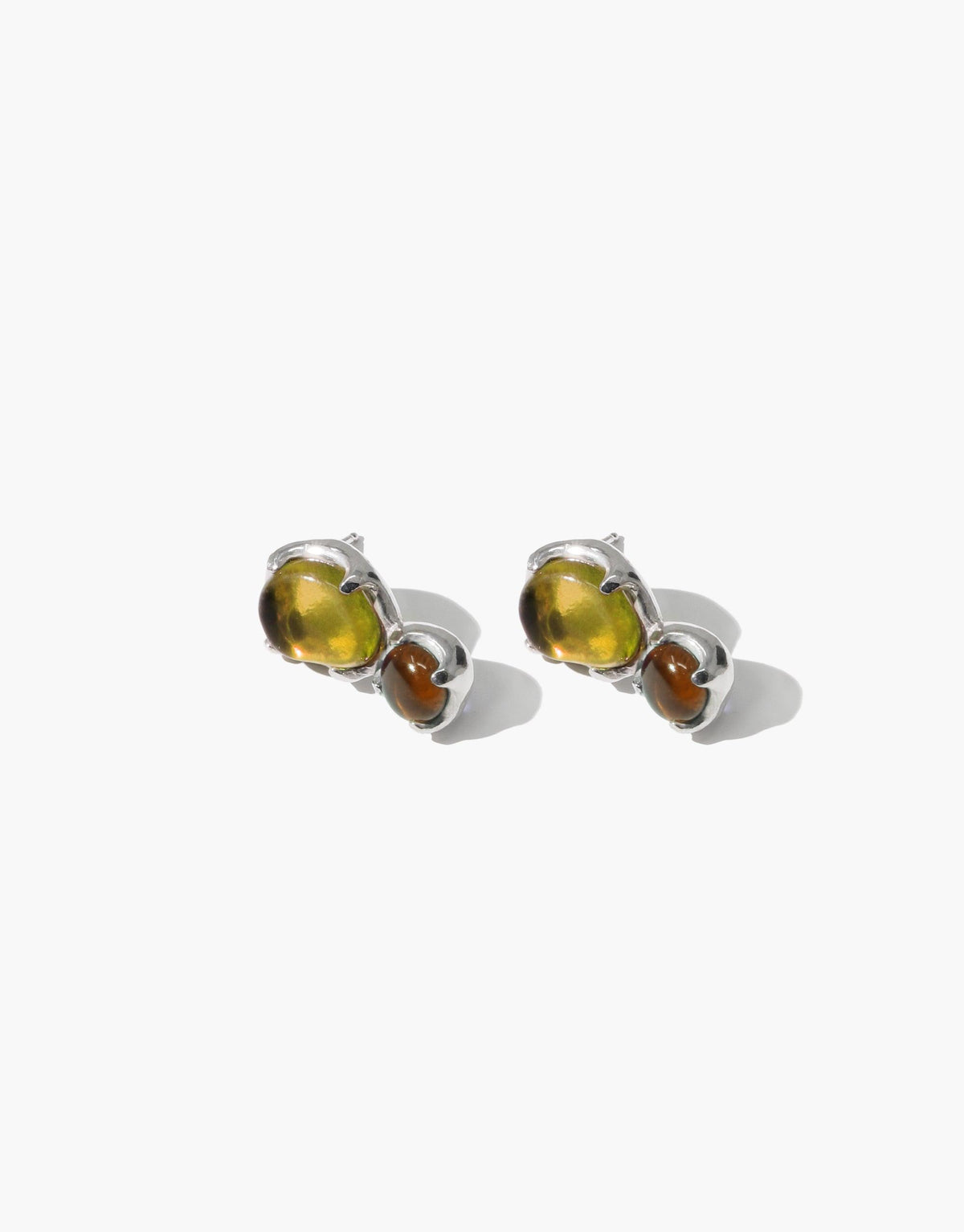 Duo Beam Earrings featuring two-toned eco gems in yellow and brown, set in silver studs. Handcrafted sustainable jewelry showcasing upcycled glass. Elegant and environmentally conscious design by CLED.