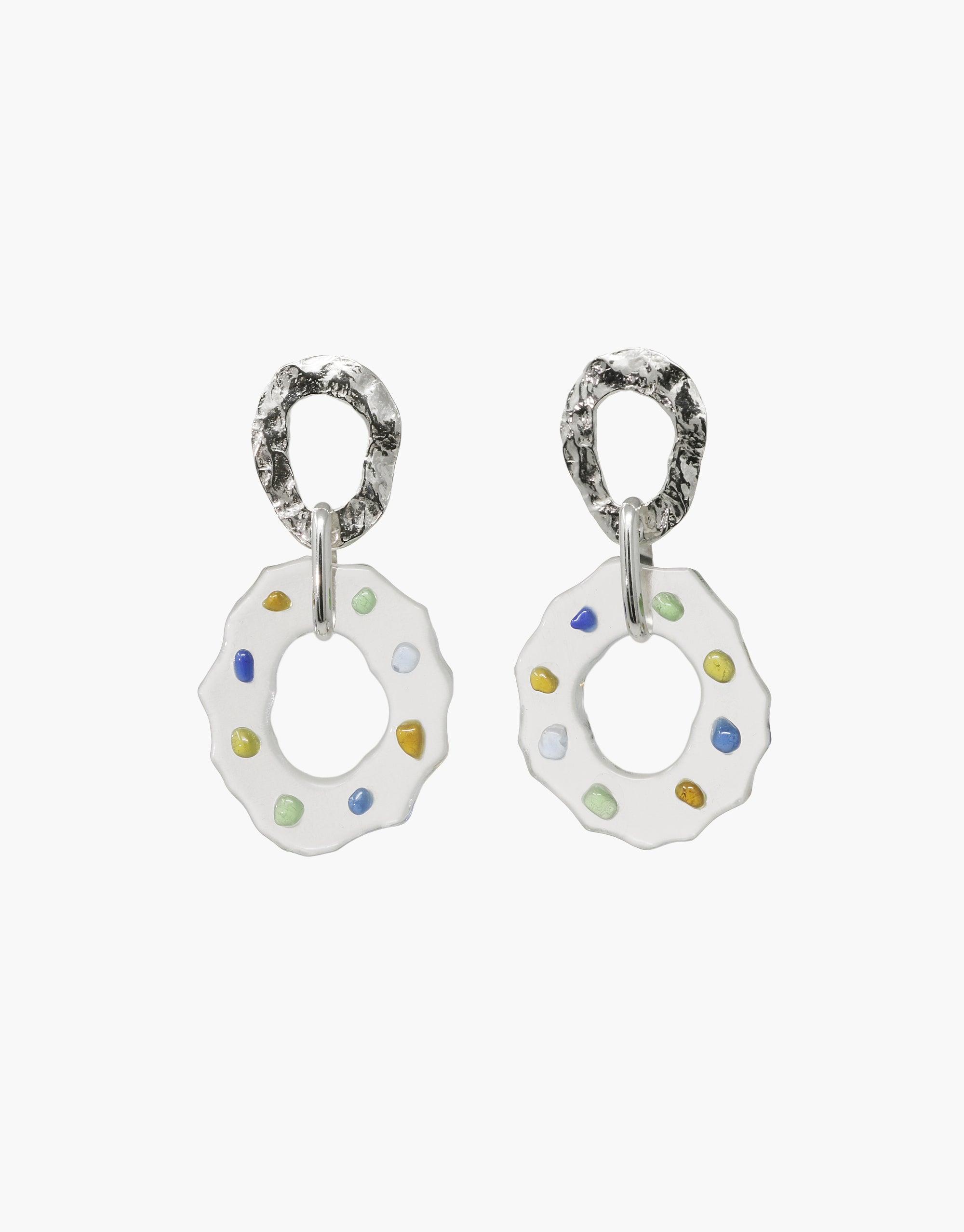 Handcrafted silver earrings with wavy circular drops featuring colorful eco-friendly glass accents, showcasing a spectrum-inspired design. Sustainable and stylish High Tide Earrings in Spectrum by CLED.