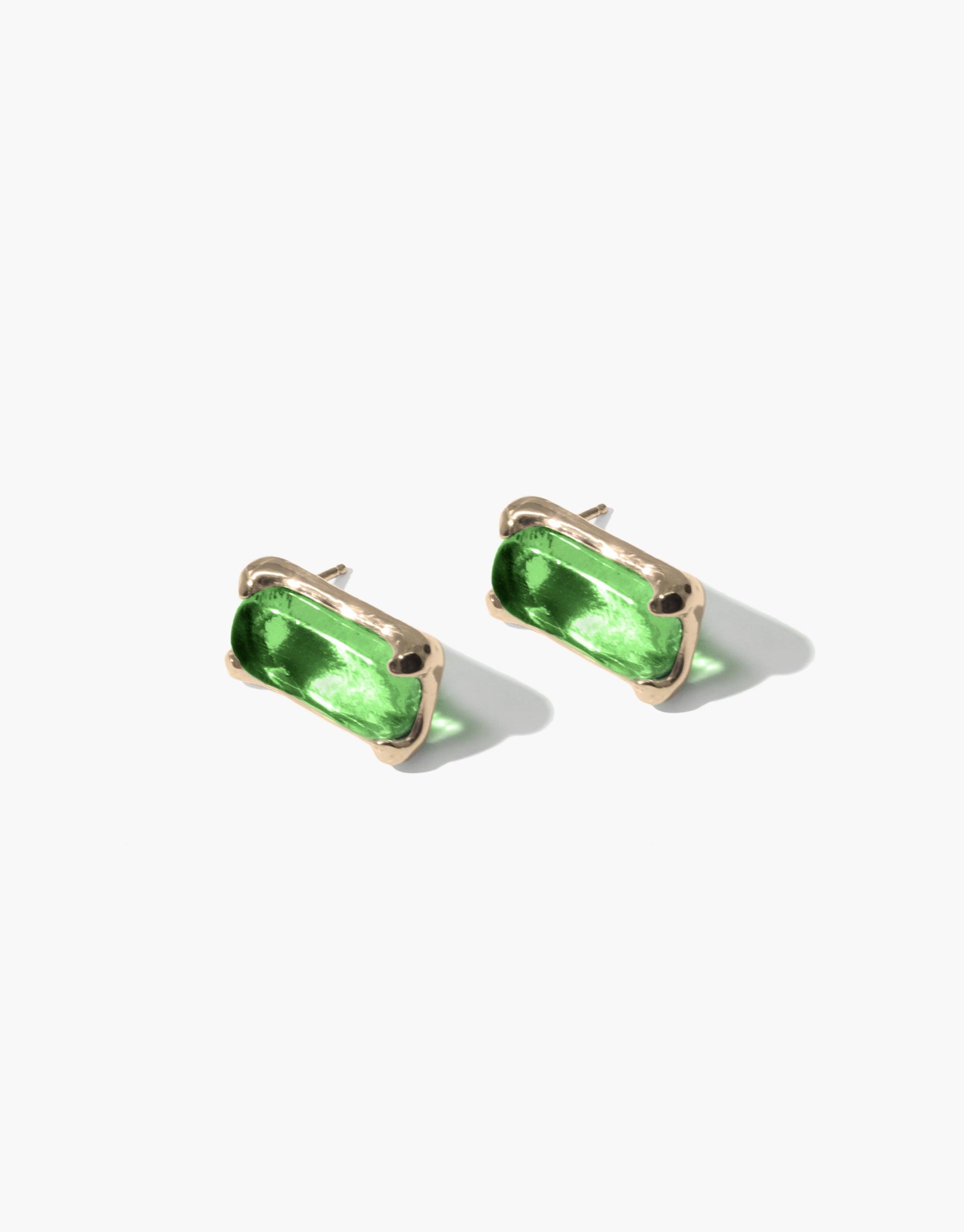 Elegant Prism Earrings featuring vibrant green eco gems set in gold-toned metal, showcasing sustainable luxury and prismatic beauty. Handcrafted rectangular studs capture light, reflecting CLED's commitment to eco-friendly jewelry design.