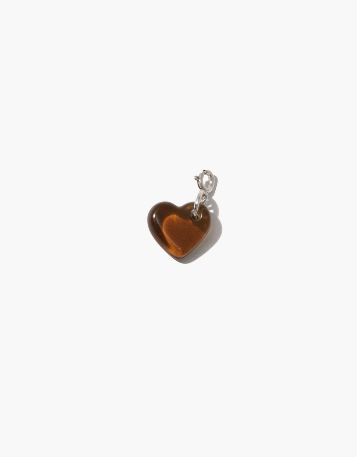 Heart-shaped amber glass charm with silver attachment, showcasing upcycled eco-friendly design. Perfect for customizing necklaces or bracelets. Handcrafted Icon Charm symbolizing love and sustainability. Heart | Icon Charm by CLED