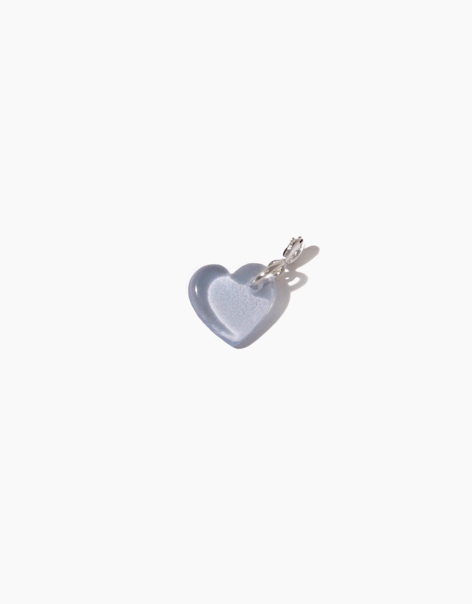 Delicate light blue heart-shaped charm with silver clasp, handcrafted from upcycled glass. Versatile accessory for necklaces or bracelets. Sustainable jewelry piece. Heart | Icon Charm by CLED