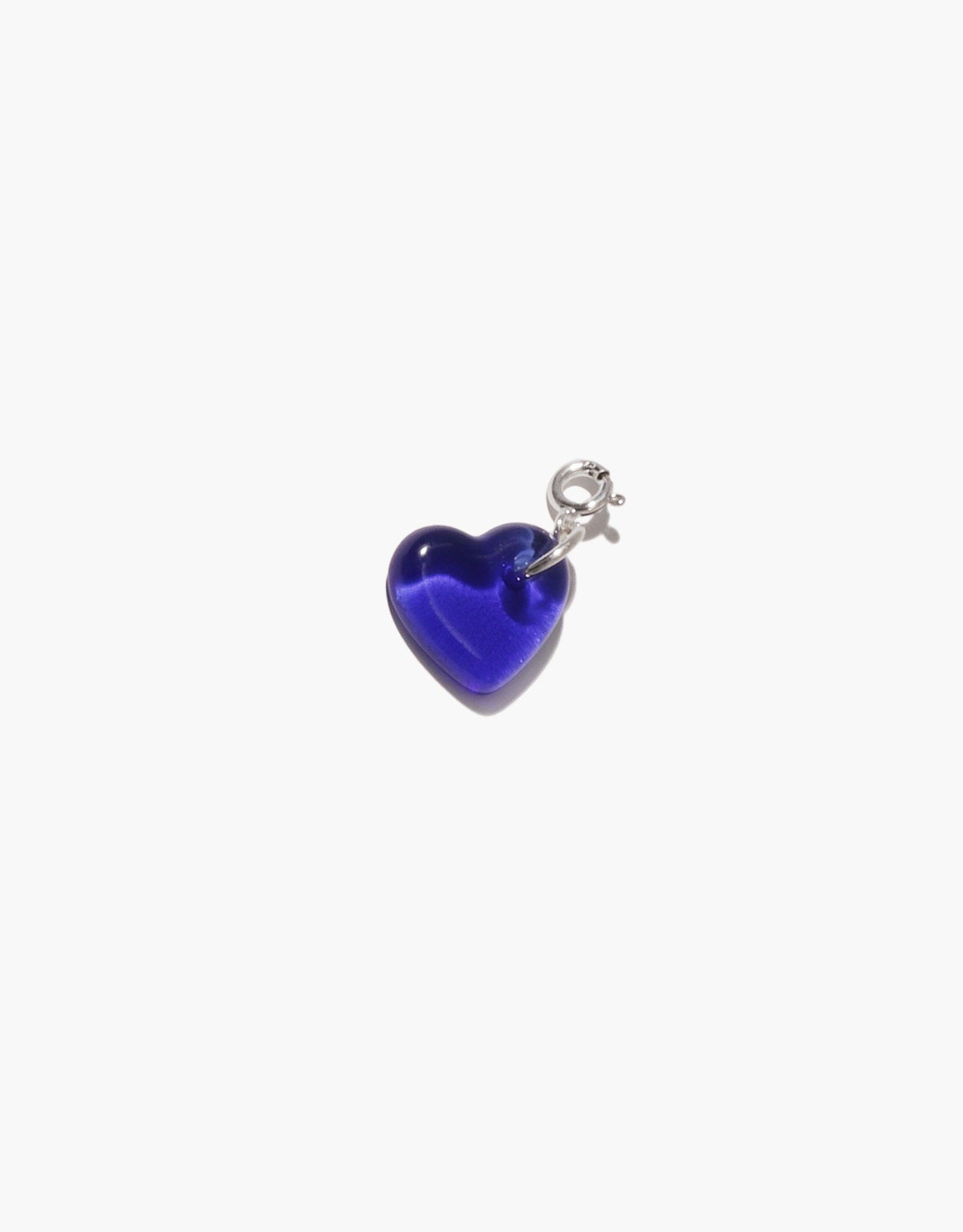 Vibrant blue heart-shaped charm made from upcycled glass, attached to a silver metal clasp. Eco-friendly jewelry piece for necklaces or bracelets. Handmade accessory showcasing sustainable design. Heart | Icon Charm by CLED